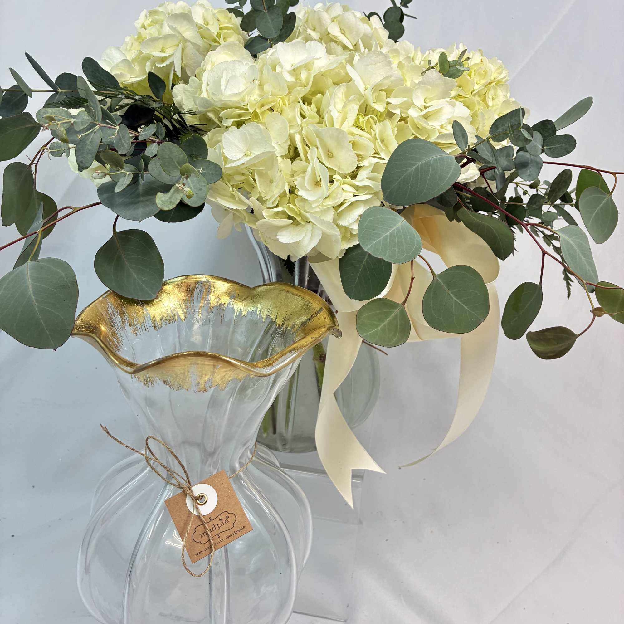 Simple elegance with fresh Hydrangeas accented with Eucalyptus is represented! Delivered in, photo 2 of 2