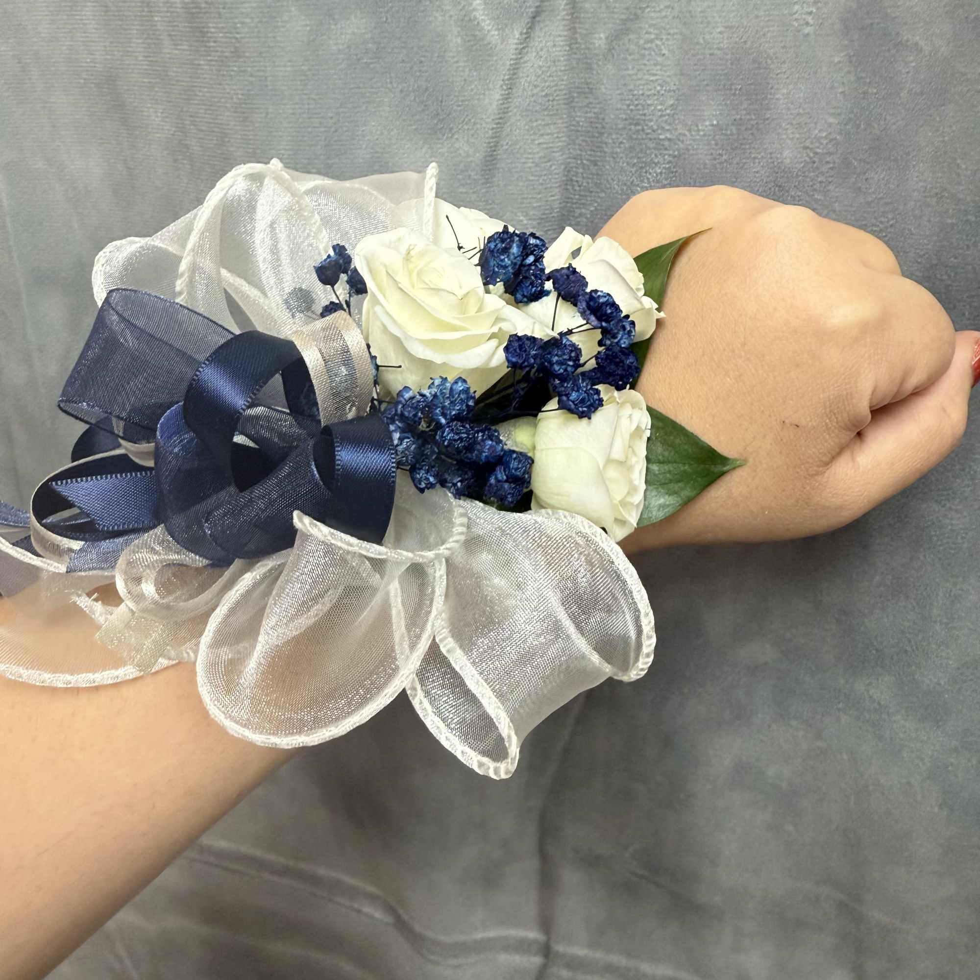 White navy spray roses wrist corsage