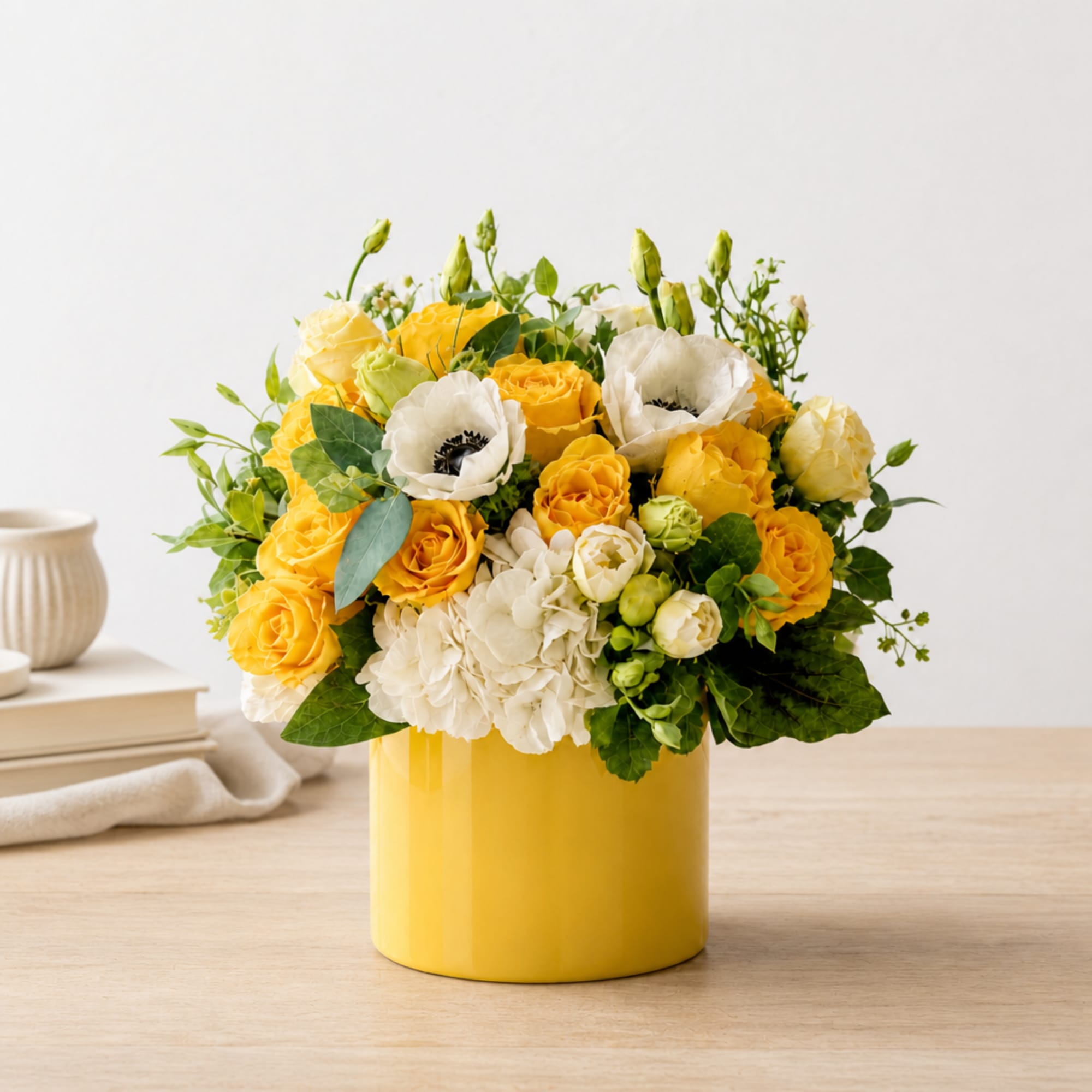 Yellow and white flower arrangement in a yellow vase, photo 2 of 3