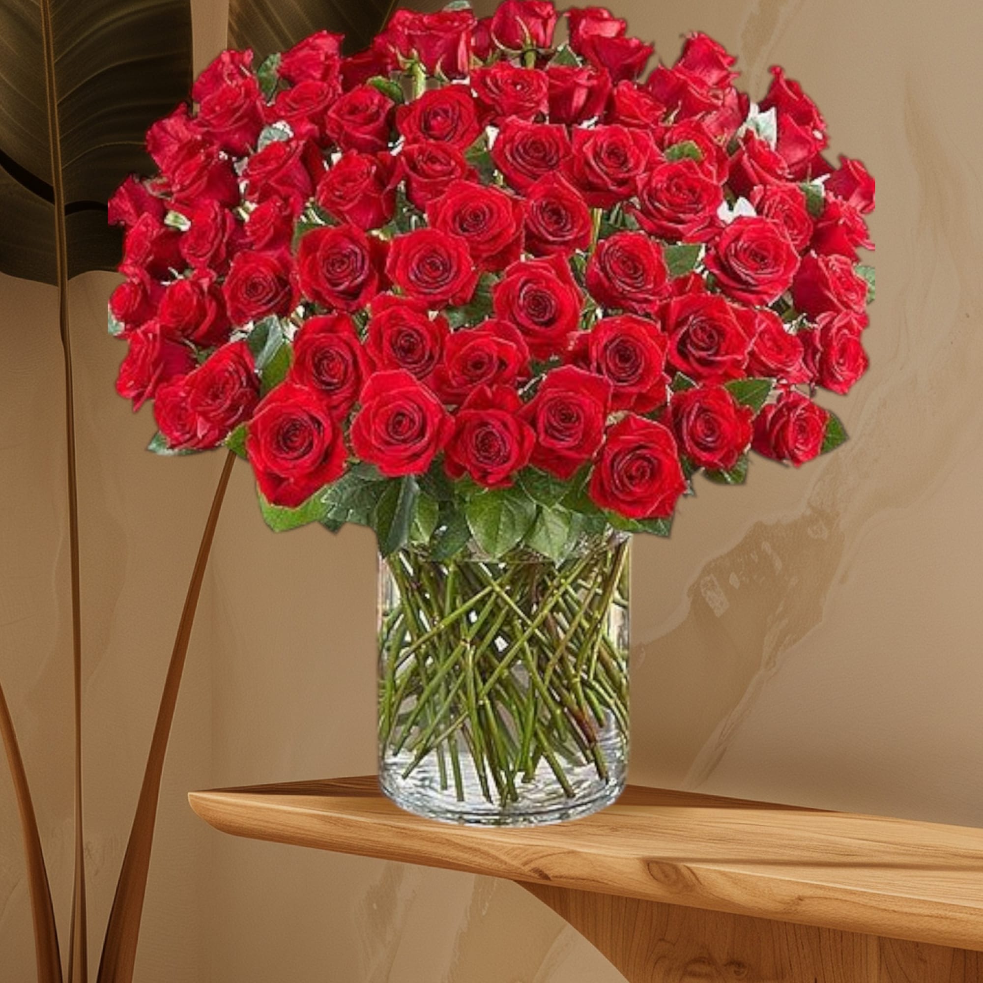 Large bouquet of red roses in a clear glass vase