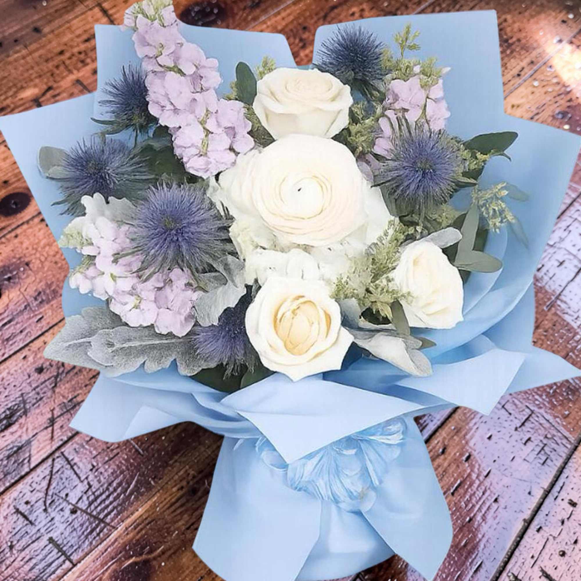 A beautiful hand-wrapped inspired by Columbia&rsquo;s signature blue, featuring elegant white roses, photo 2 of 3