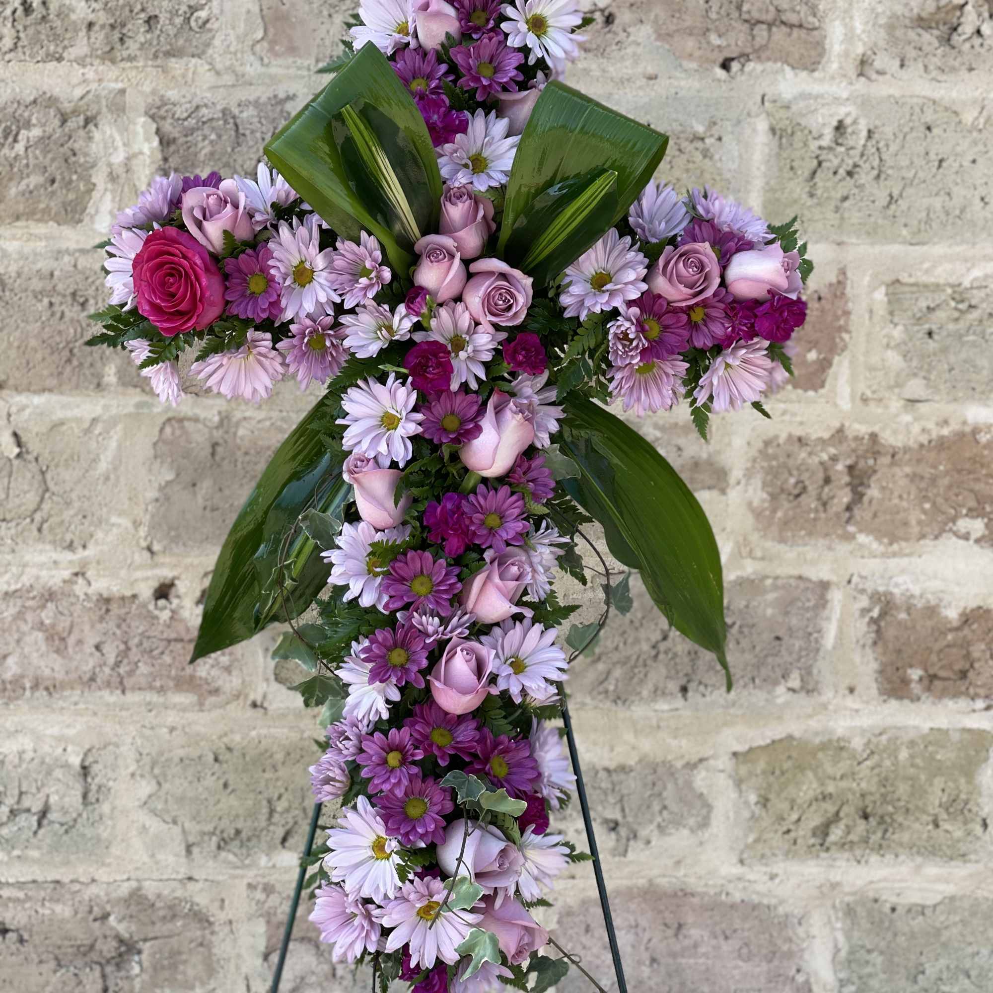 Praise your loved one with a floral cross that truly represents their