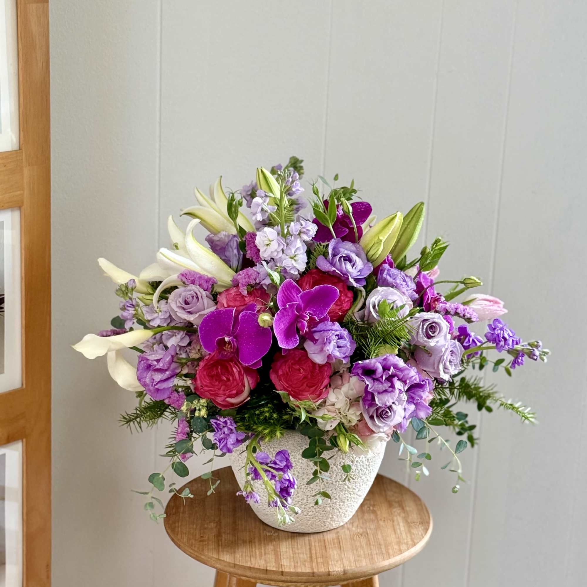 Make a breathtaking statement with  a lavish floral masterpiece designed to