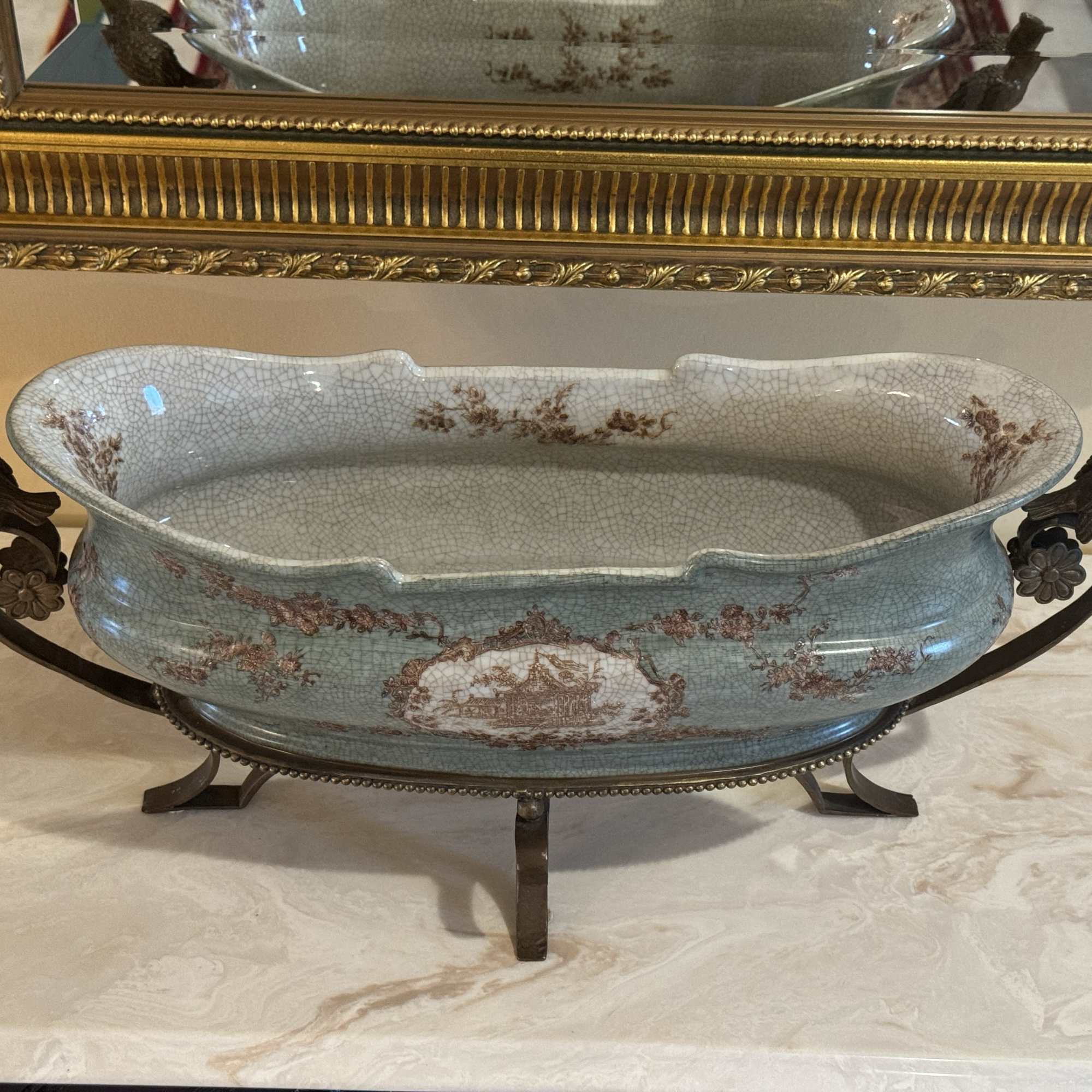 Beautiful Porcelain Centerpiece Cachepot with bronze handles and legs and beautiful detailing.
Excellent
