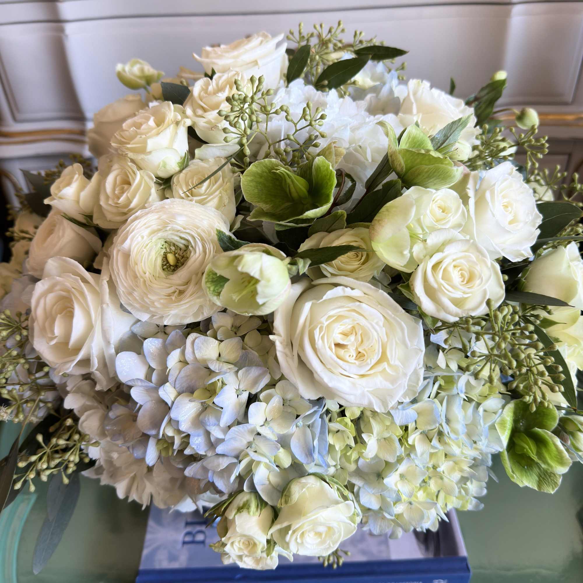 White rose and hydrangea bouquet with green accents, photo 3 of 5