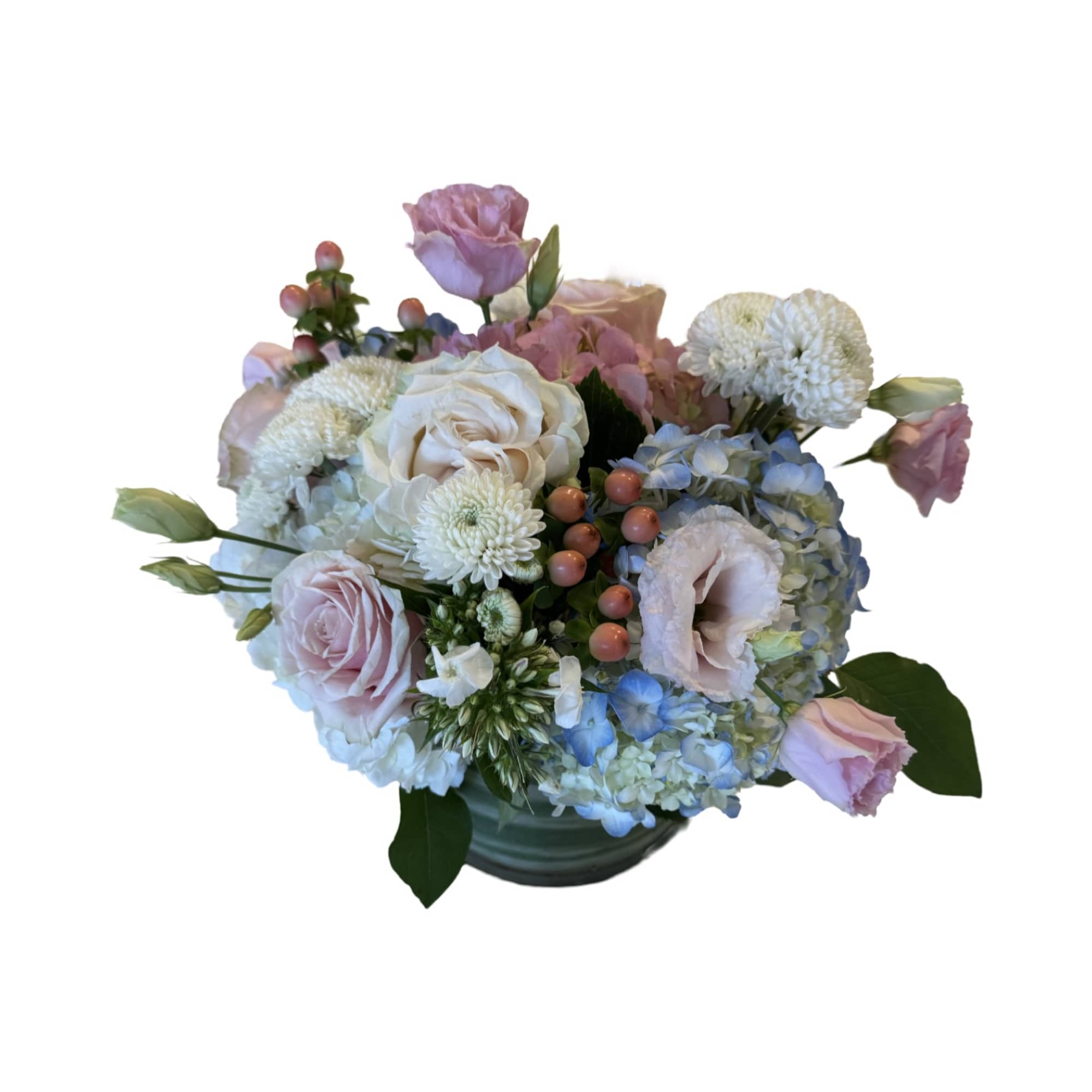 Pastel bouquet of roses, hydrangeas, and white mums in a vase
