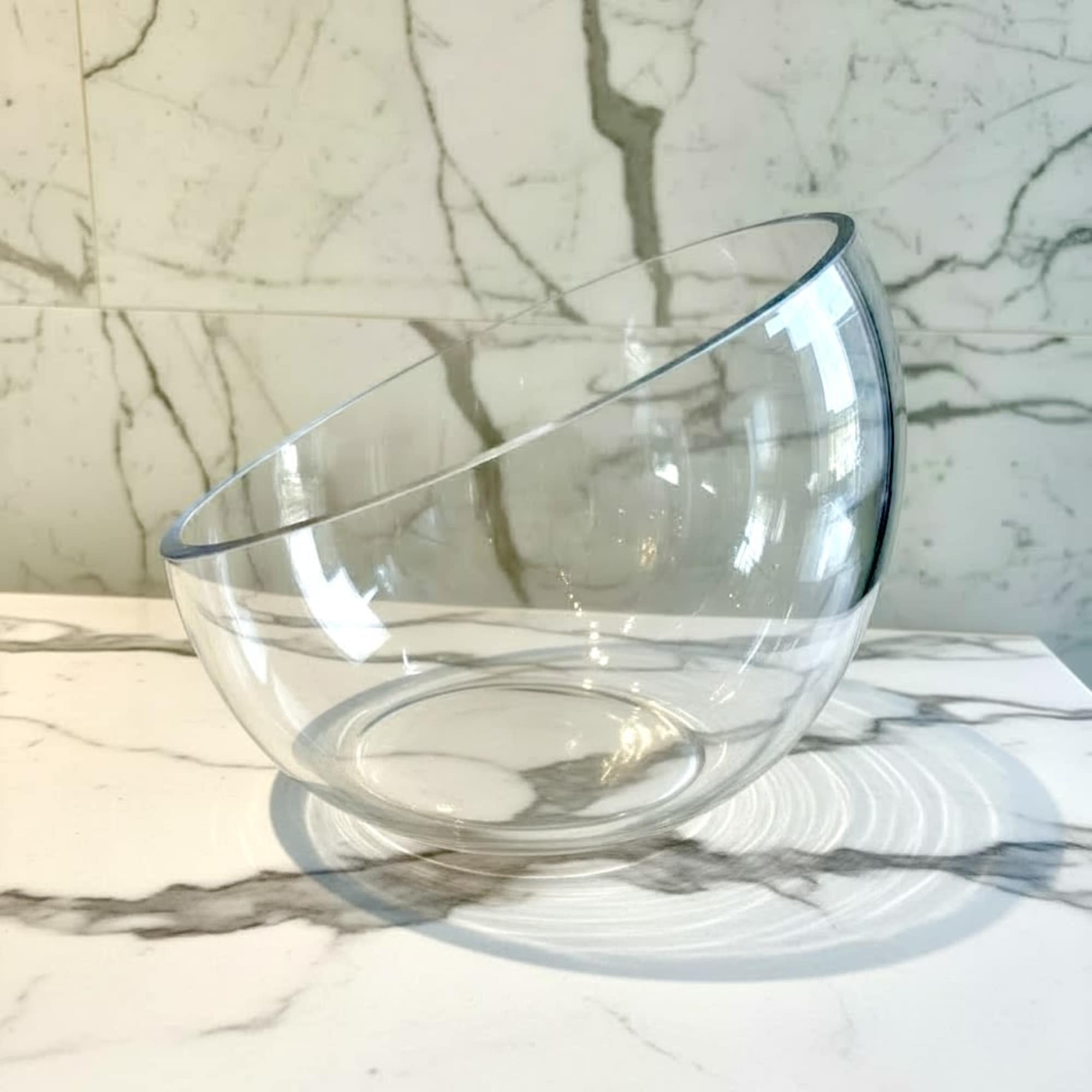 Clear glass bowl on a marble surface