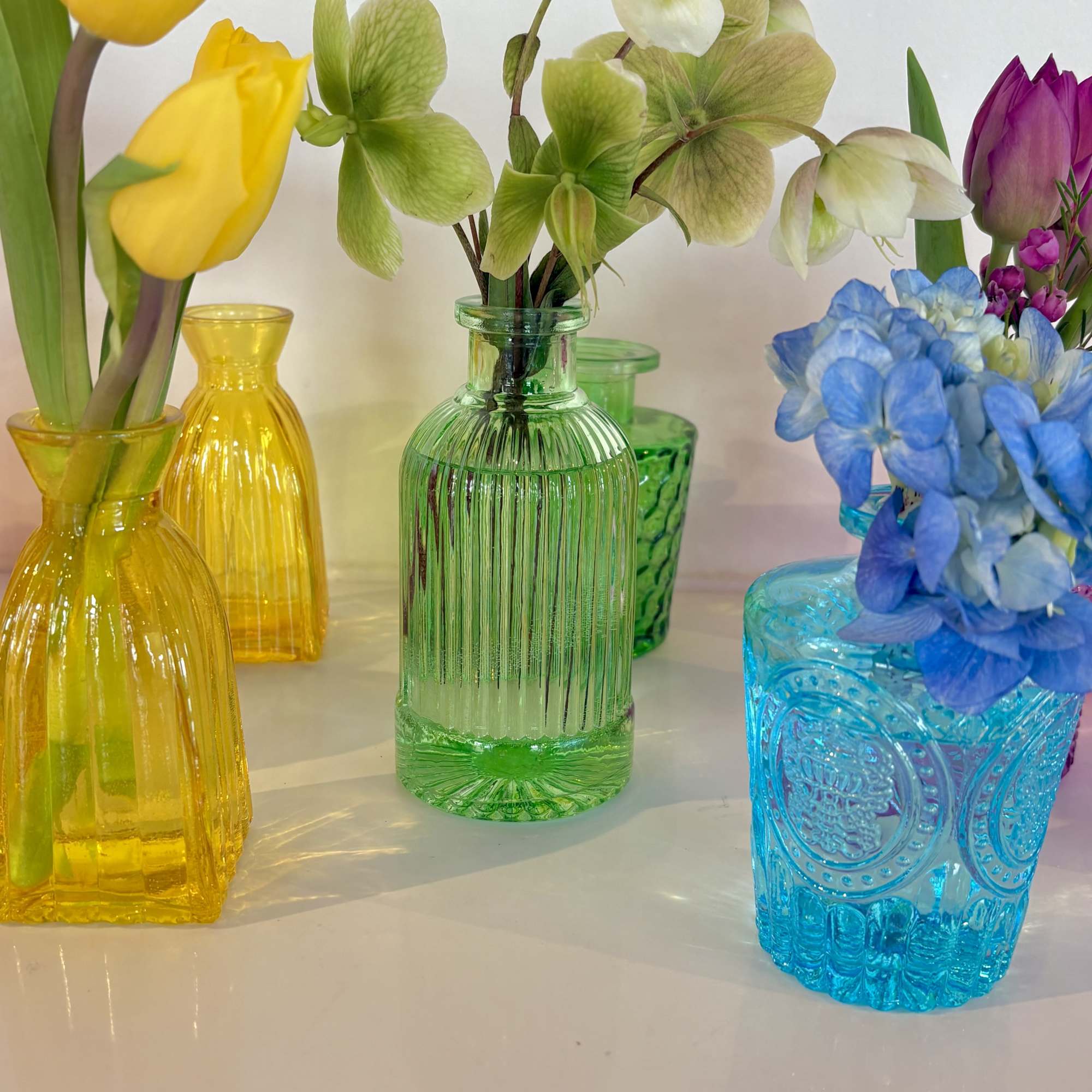 A playful rainbow of petite bud vases brings instant cheer - perfect, photo 2 of 2