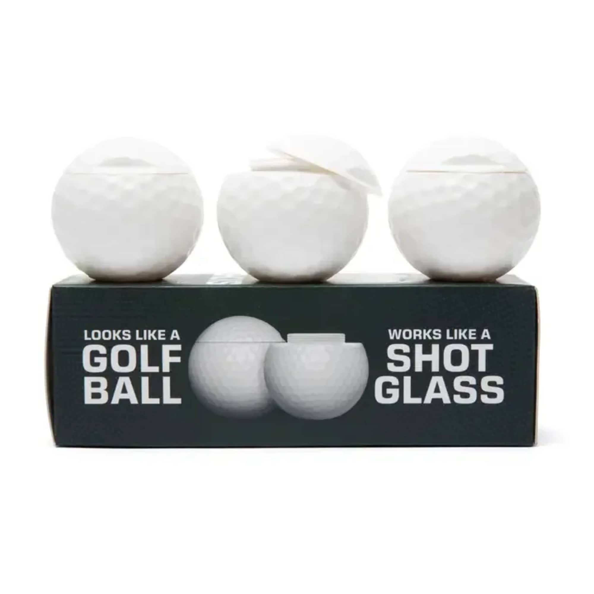Three white golf ball-shaped shot glasses on a black box
