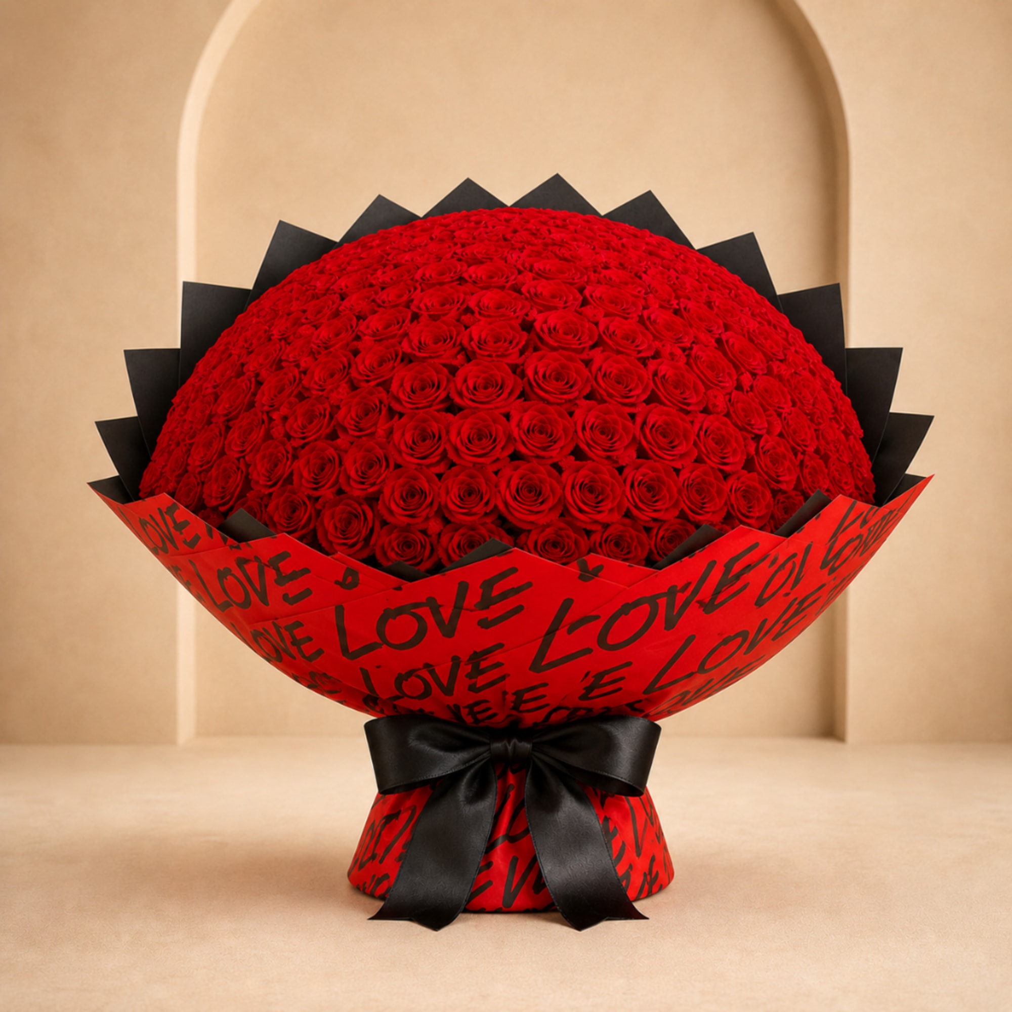 Large bouquet of red roses wrapped in red paper with black ribbon