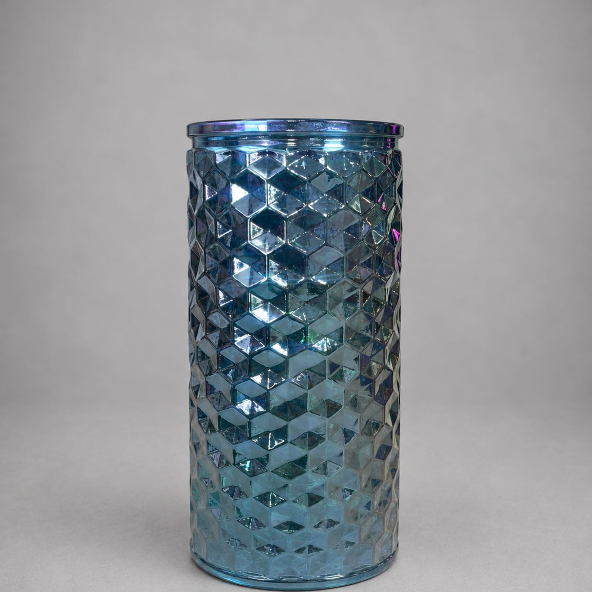 Blue faceted glass vase with a cylindrical shape