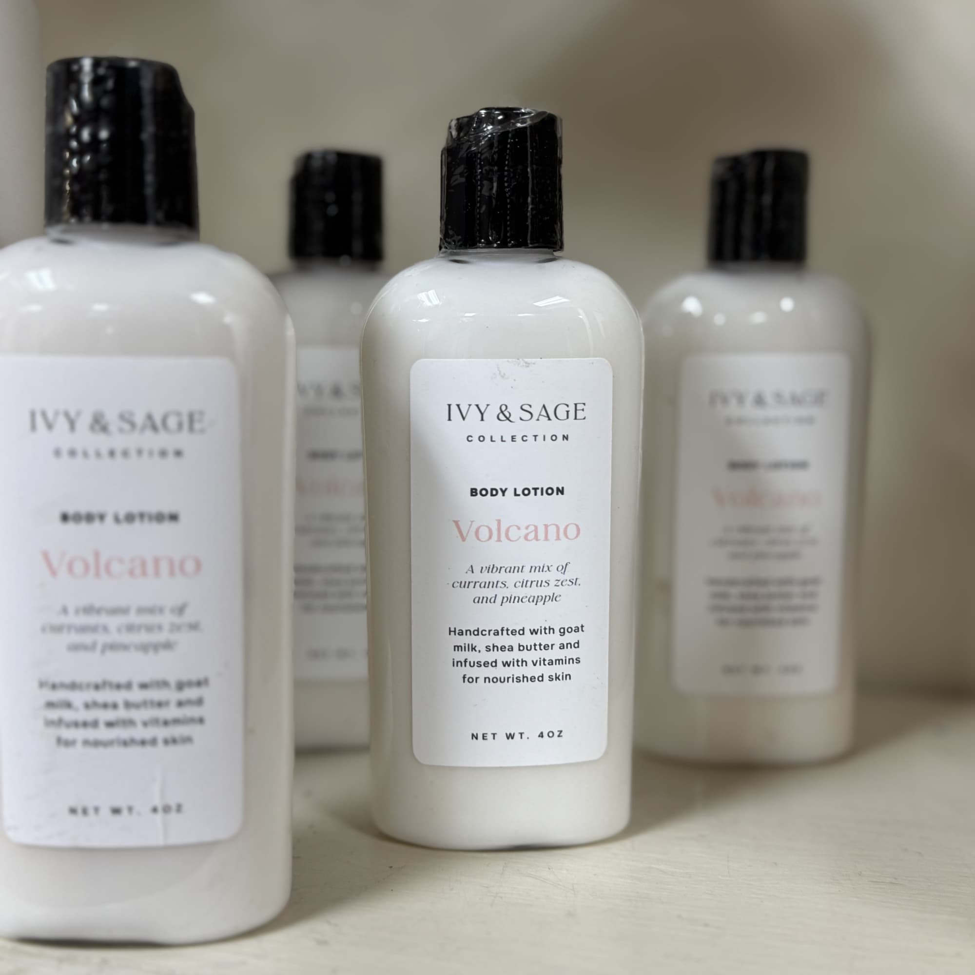 Four bottles of Ivy & Sage body lotion on a shelf
