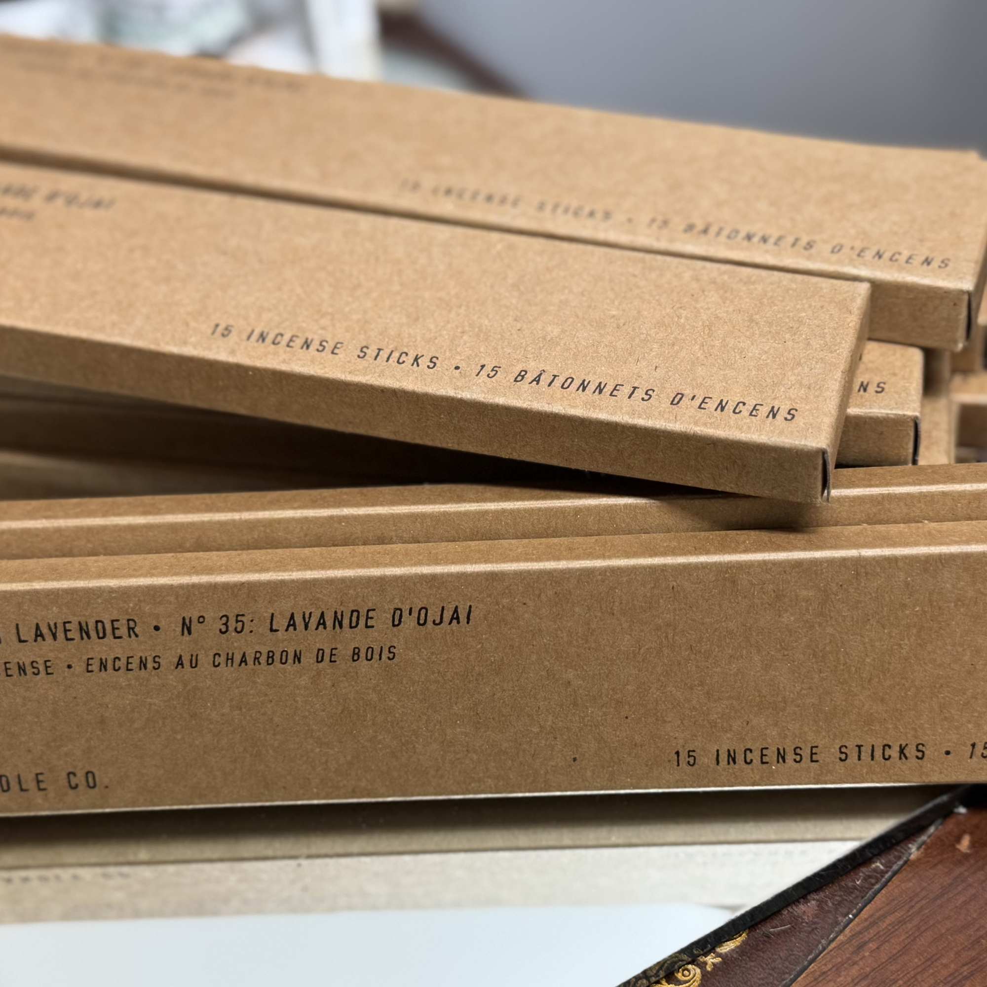Stack of boxed incense sticks on a table