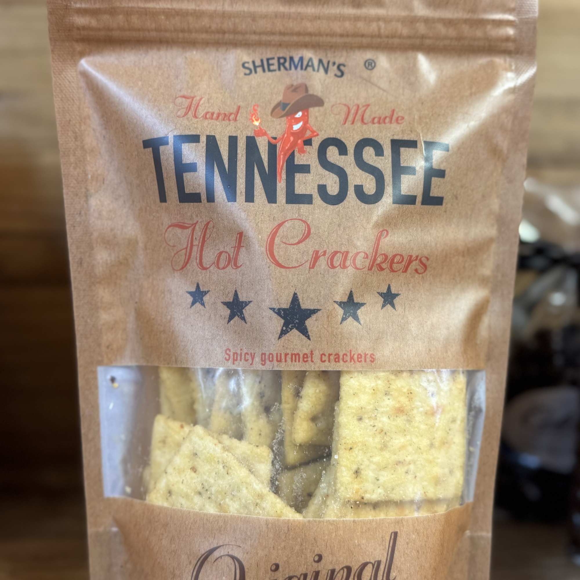 A bag of Sherman’s Tennessee hot crackers on a wooden surface.