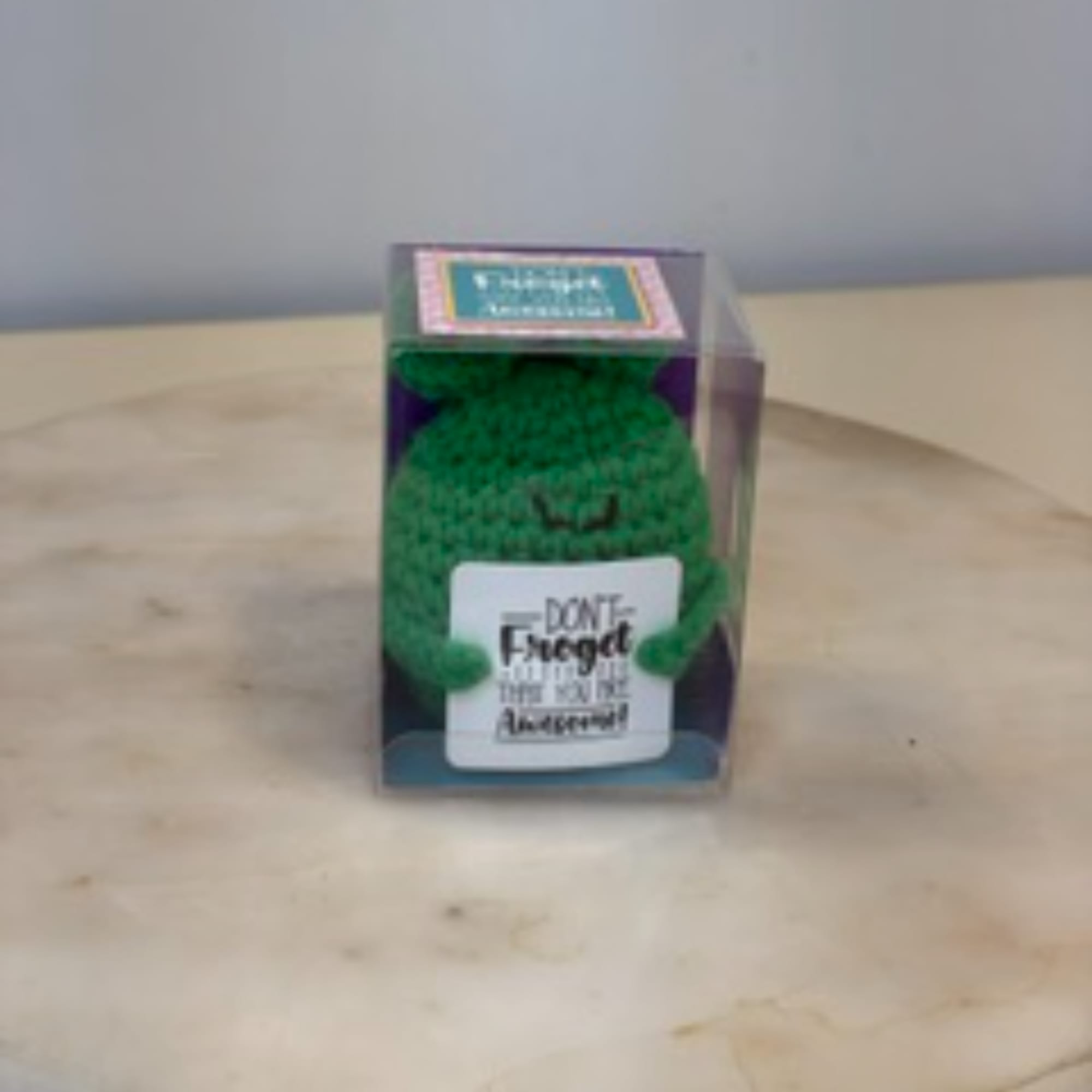 Small green plush toy in a clear display box, photo 8 of 9