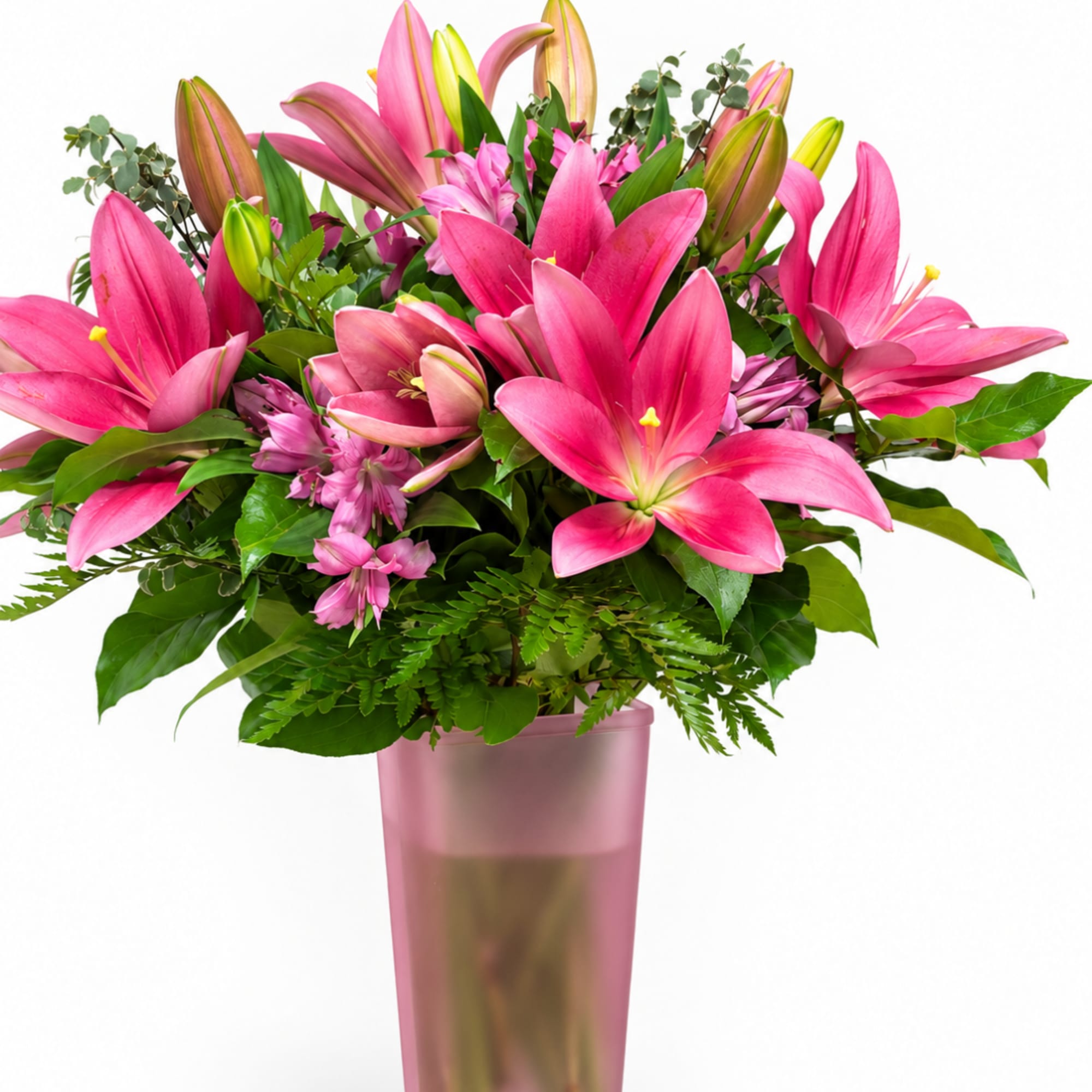 Pink lilies arranged in a tall pink vase