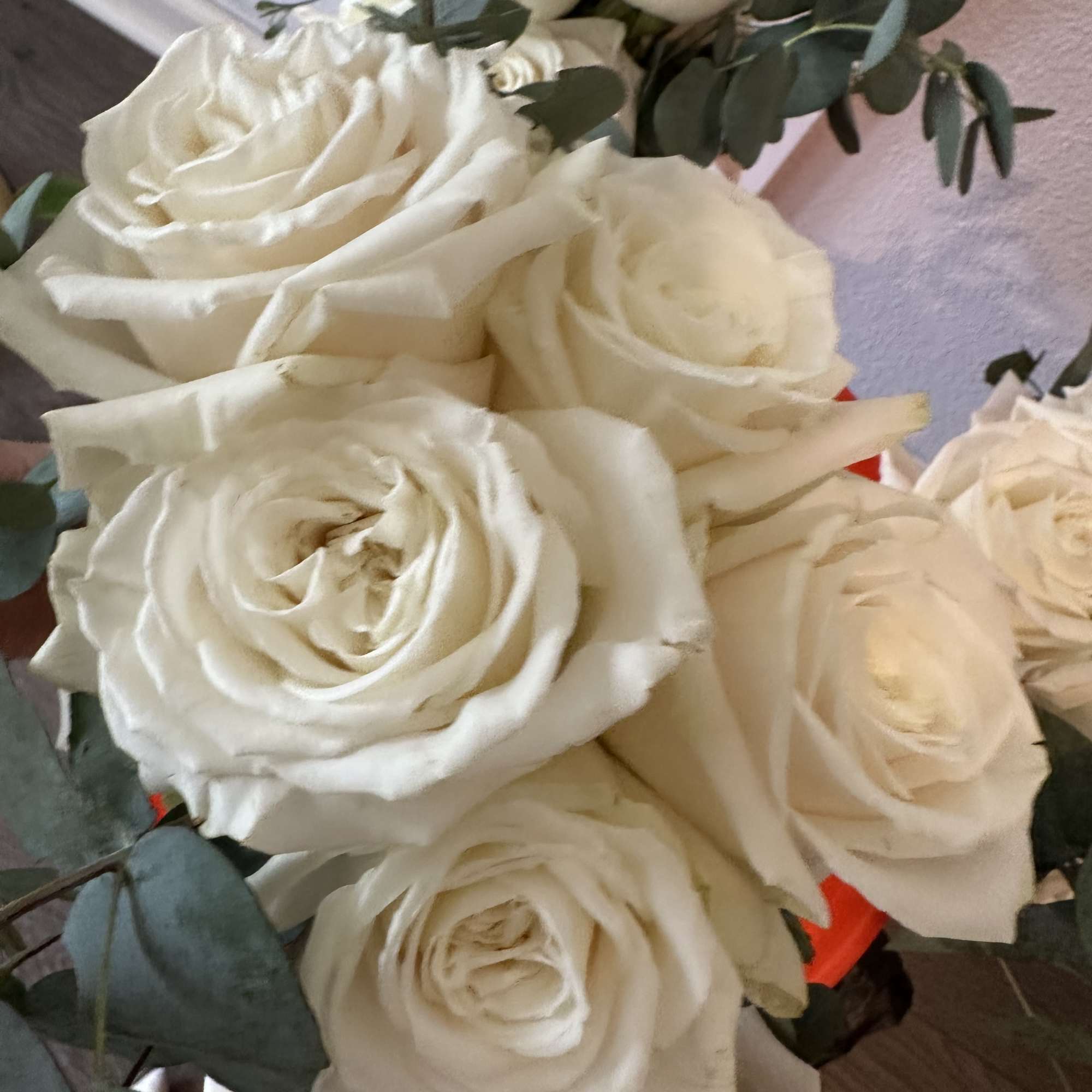 Bouquet of white roses with eucalyptus greenery