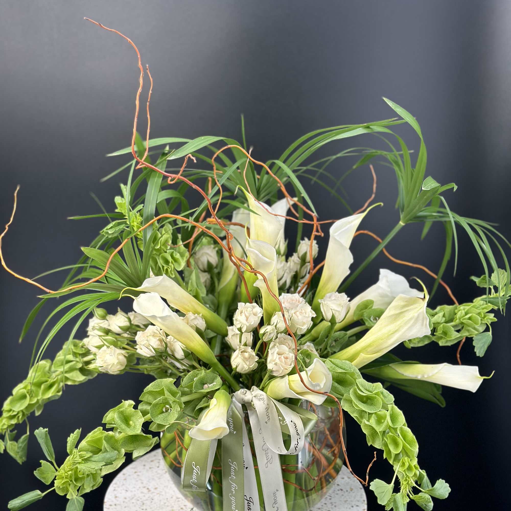 A very elegance ,luxurious fresh white calla lilies and rich seasonal greens, photo 2 of 4