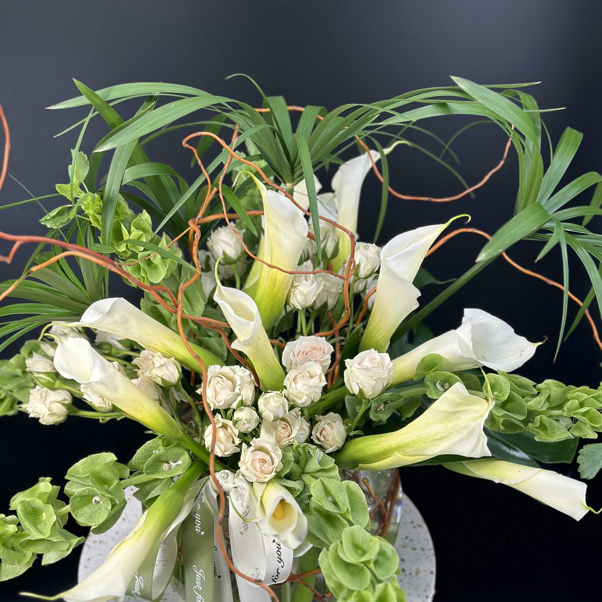 A very elegance ,luxurious fresh white calla lilies and rich seasonal greens, photo 3 of 4