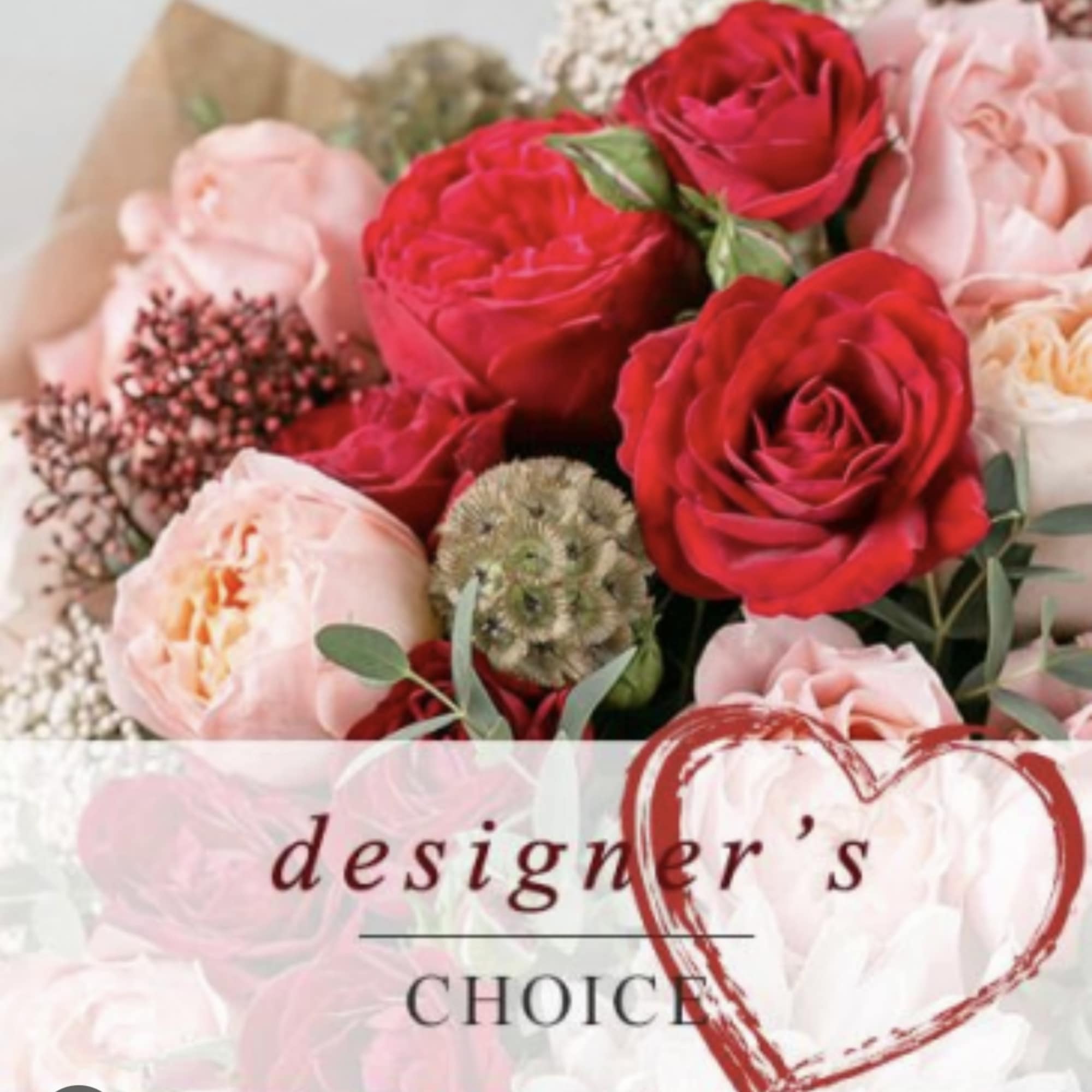 Bouquet of red and blush roses with pale filler flowers