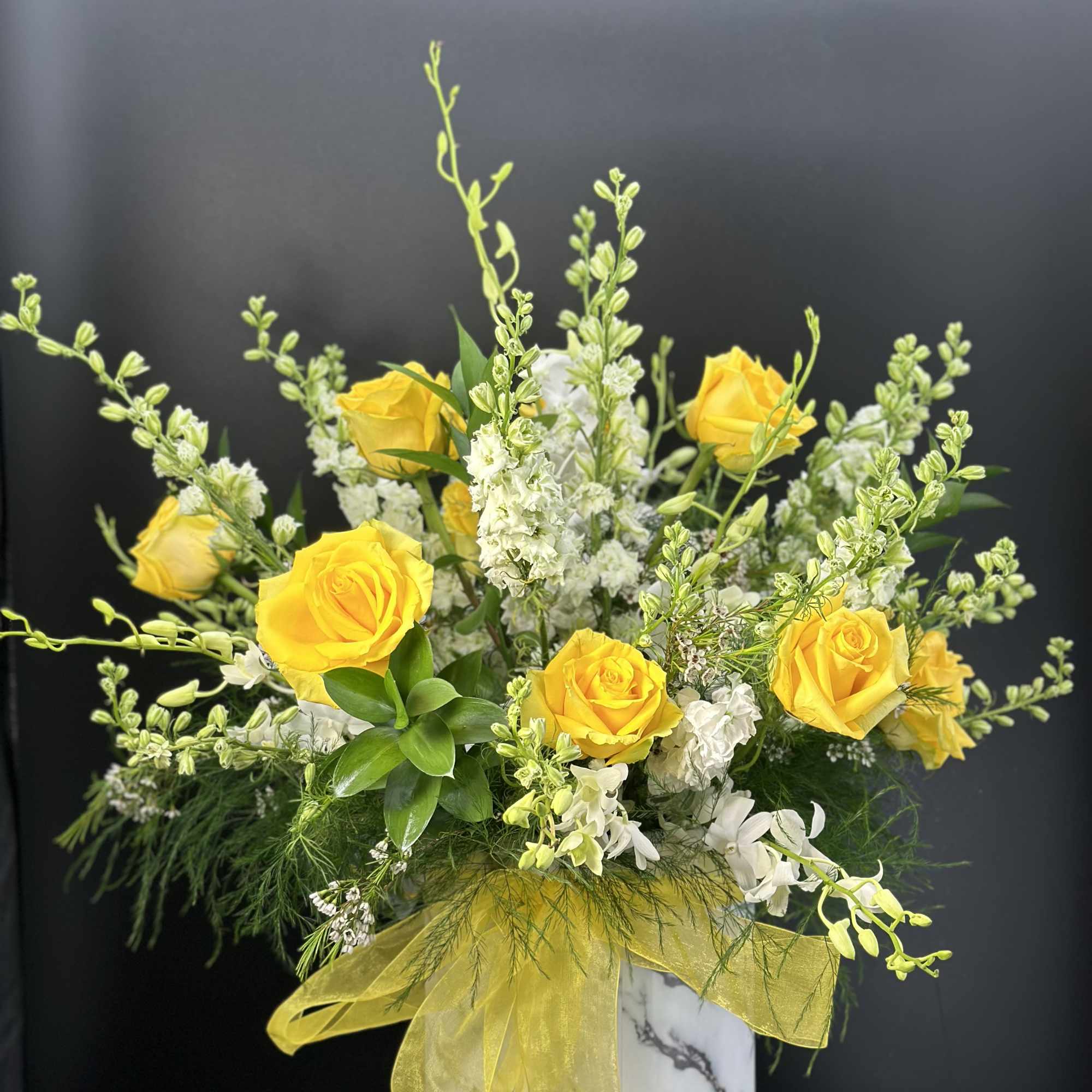 Beautiful yellow roses , greenery and flowers box is a great combination