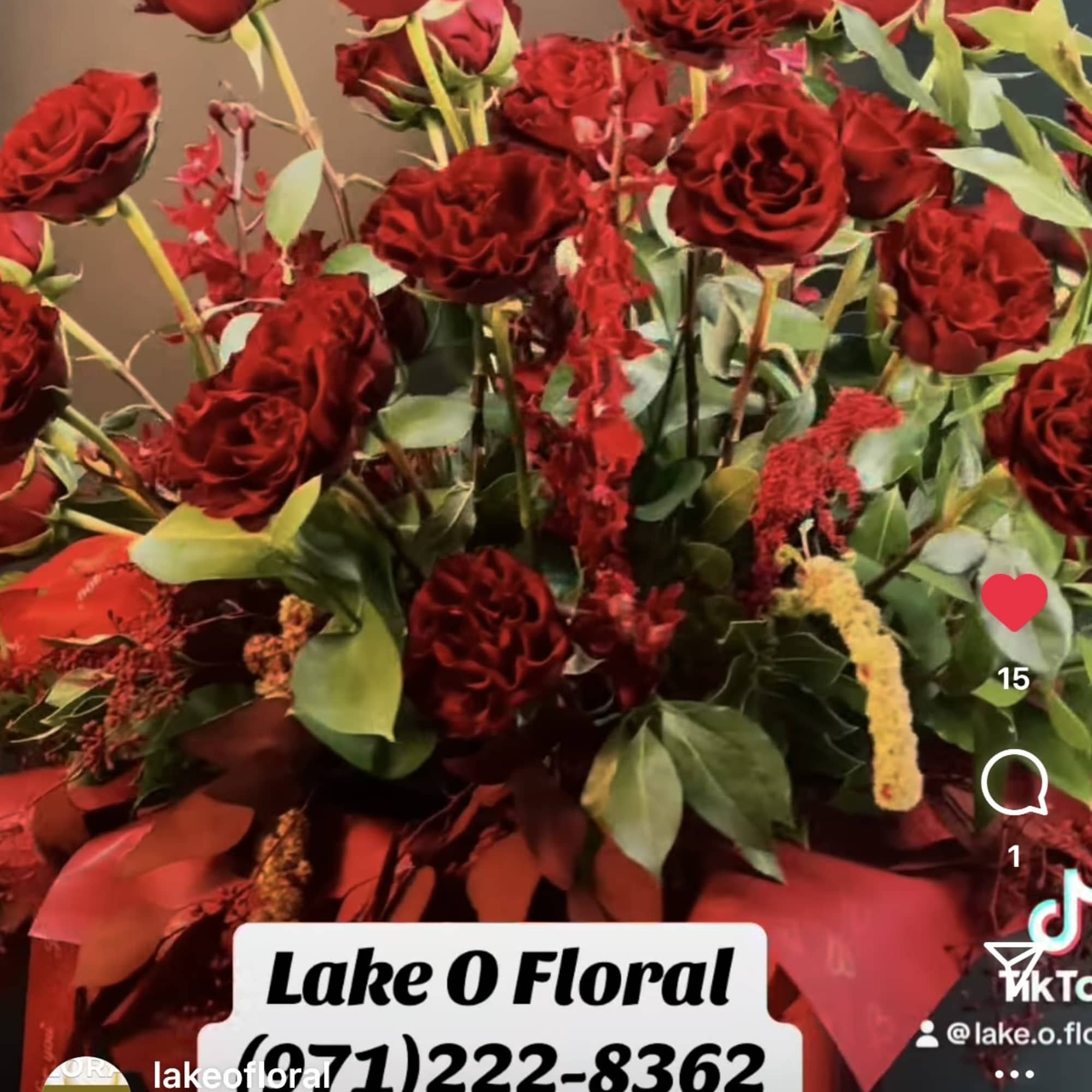 A striking arrangement of velvety red  hearts roses ,artfully composed with, photo 2 of 2