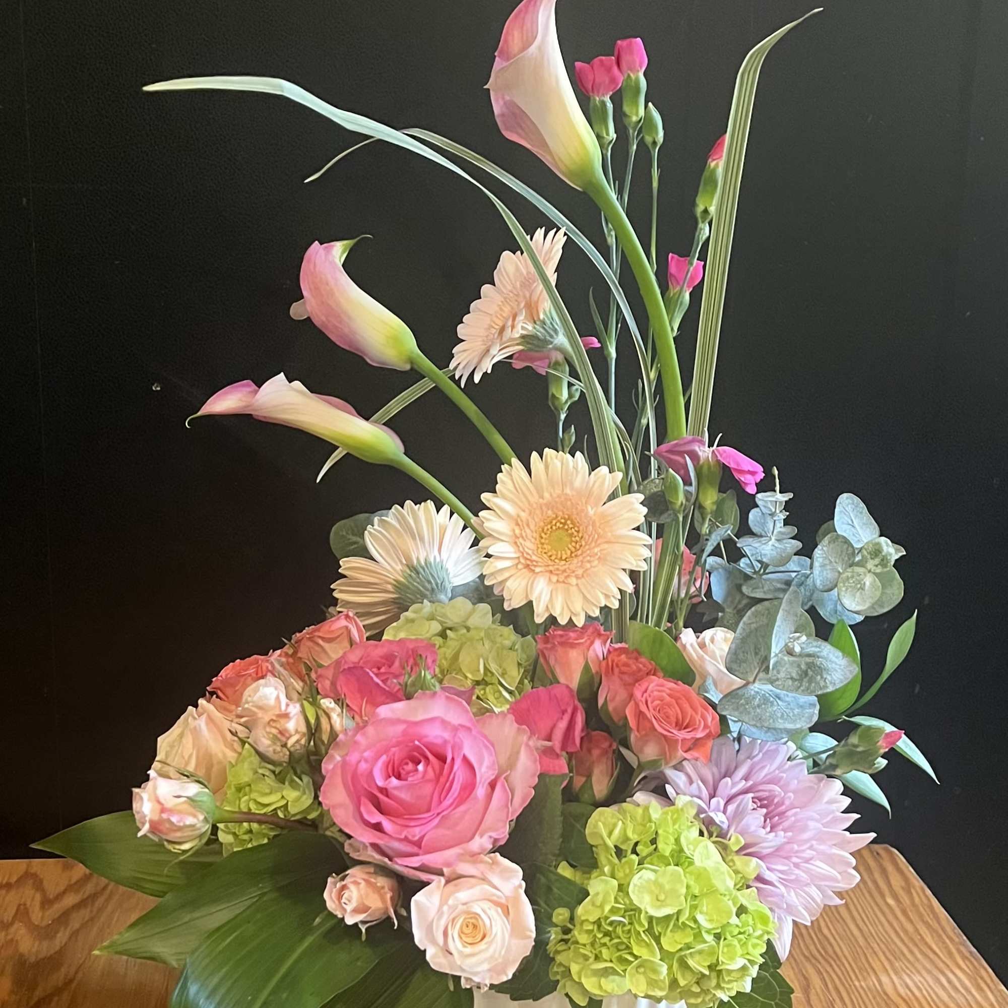 An elegant Ikebana style arrangement that reaches new heights &mdash; soft pinks