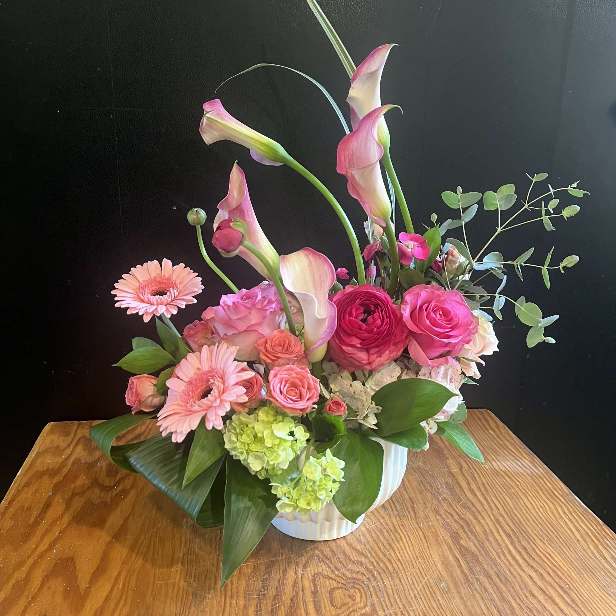 An elegant Ikebana style arrangement that reaches new heights &mdash; soft pinks