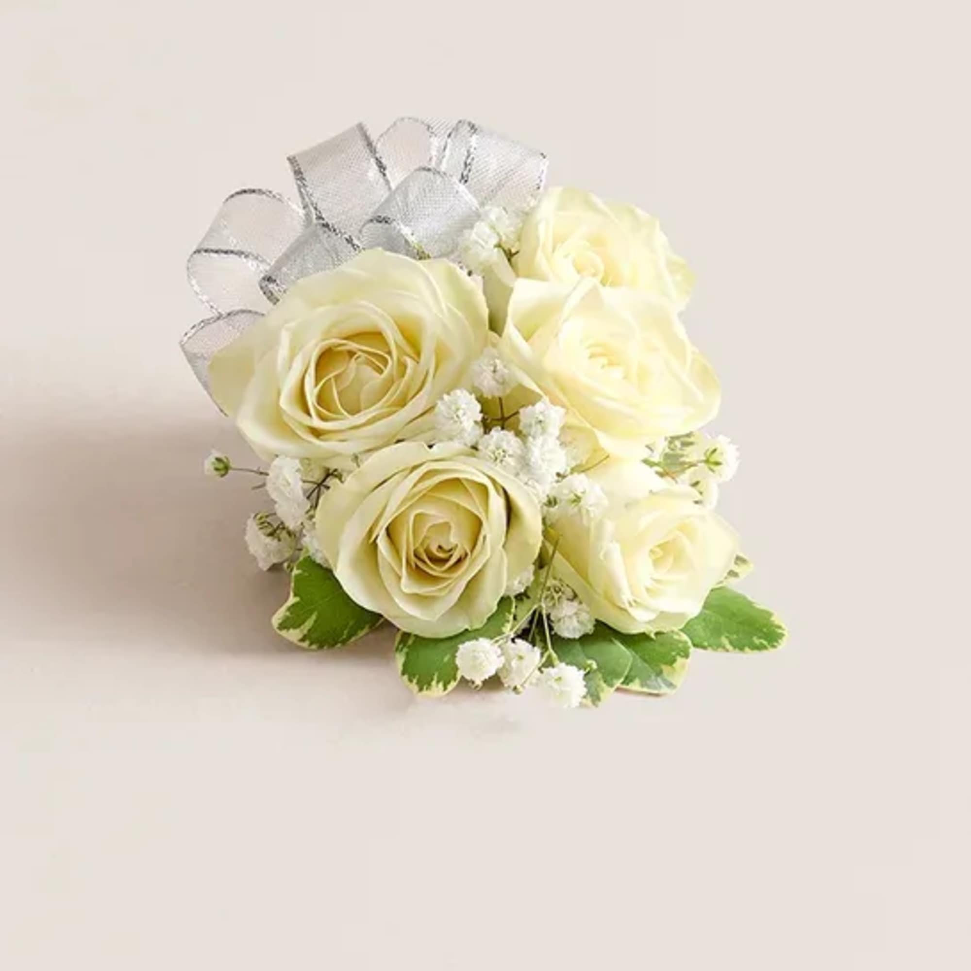 Cream rose bouquet with white filler flowers and a silver ribbon bow