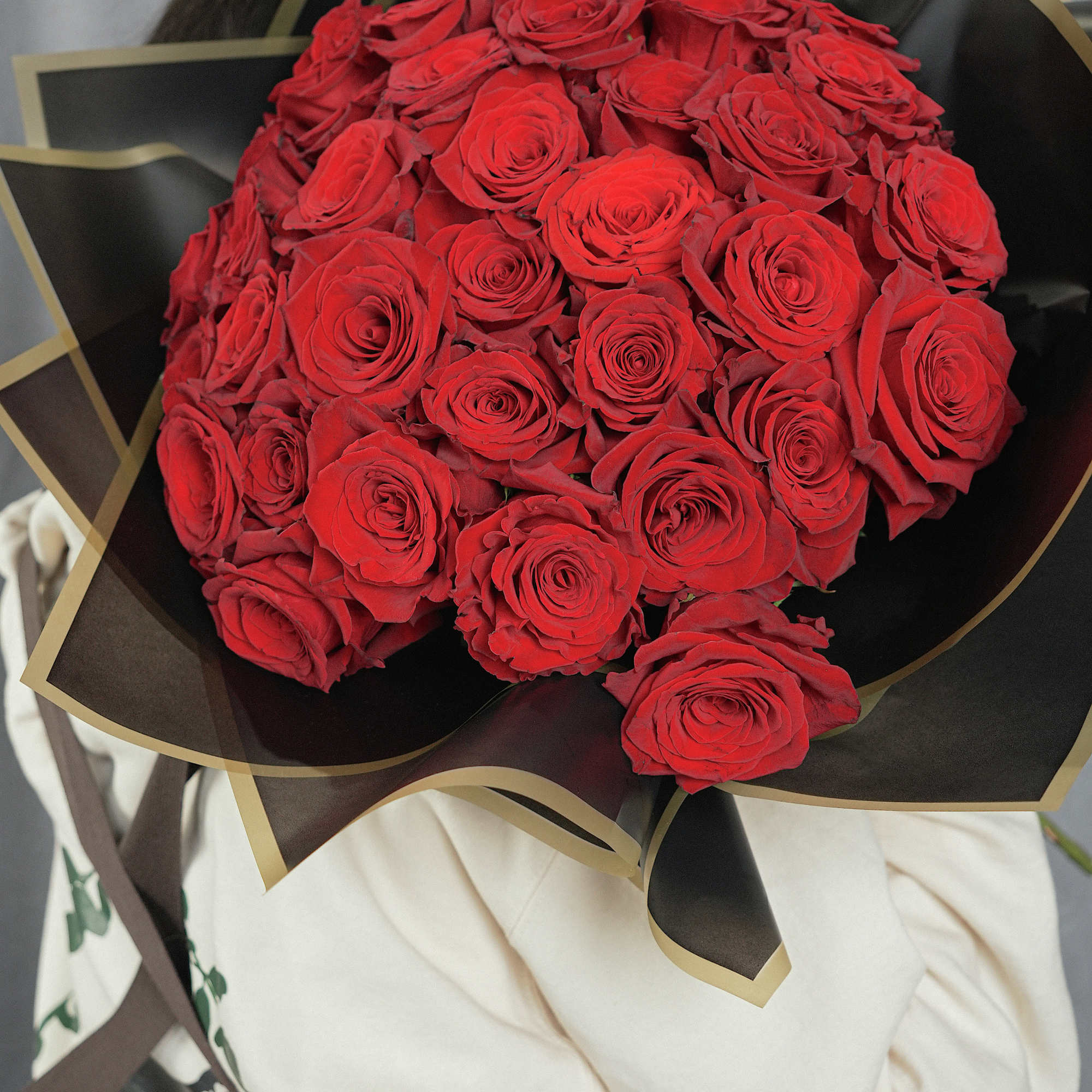 Bold and luxurious buch&oacute;n-style bouquet featuring 35 premium red roses, imported from, photo 2 of 3