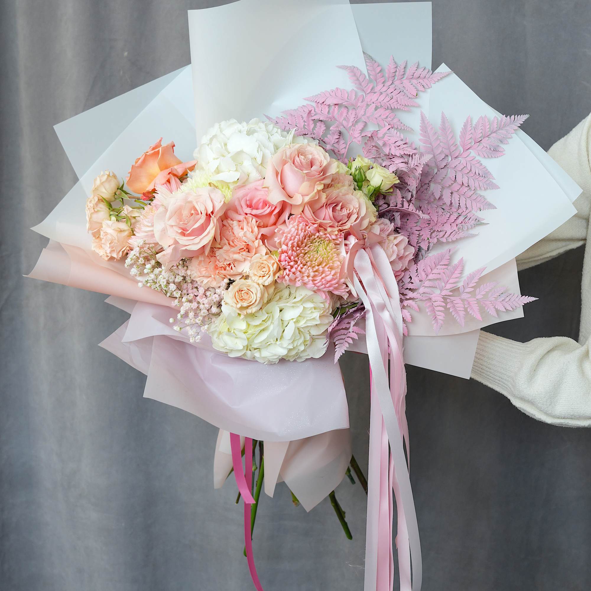 This elegant bouquet is wrapped in premium Korean-style paper and designed with