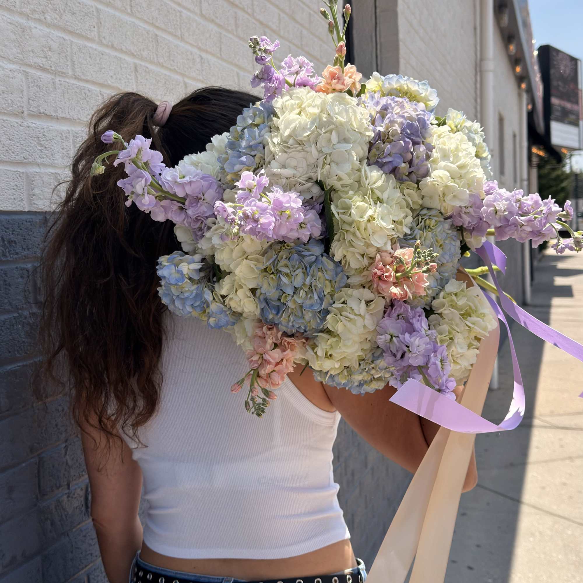 Creamy white hydrangeas take center stage in this large hand-tied bouquet, their, photo 2 of 2