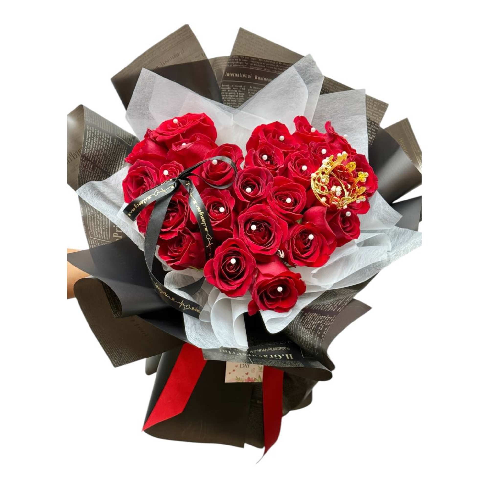 Bouquet of red roses wrapped in black and white paper with a red ribbon