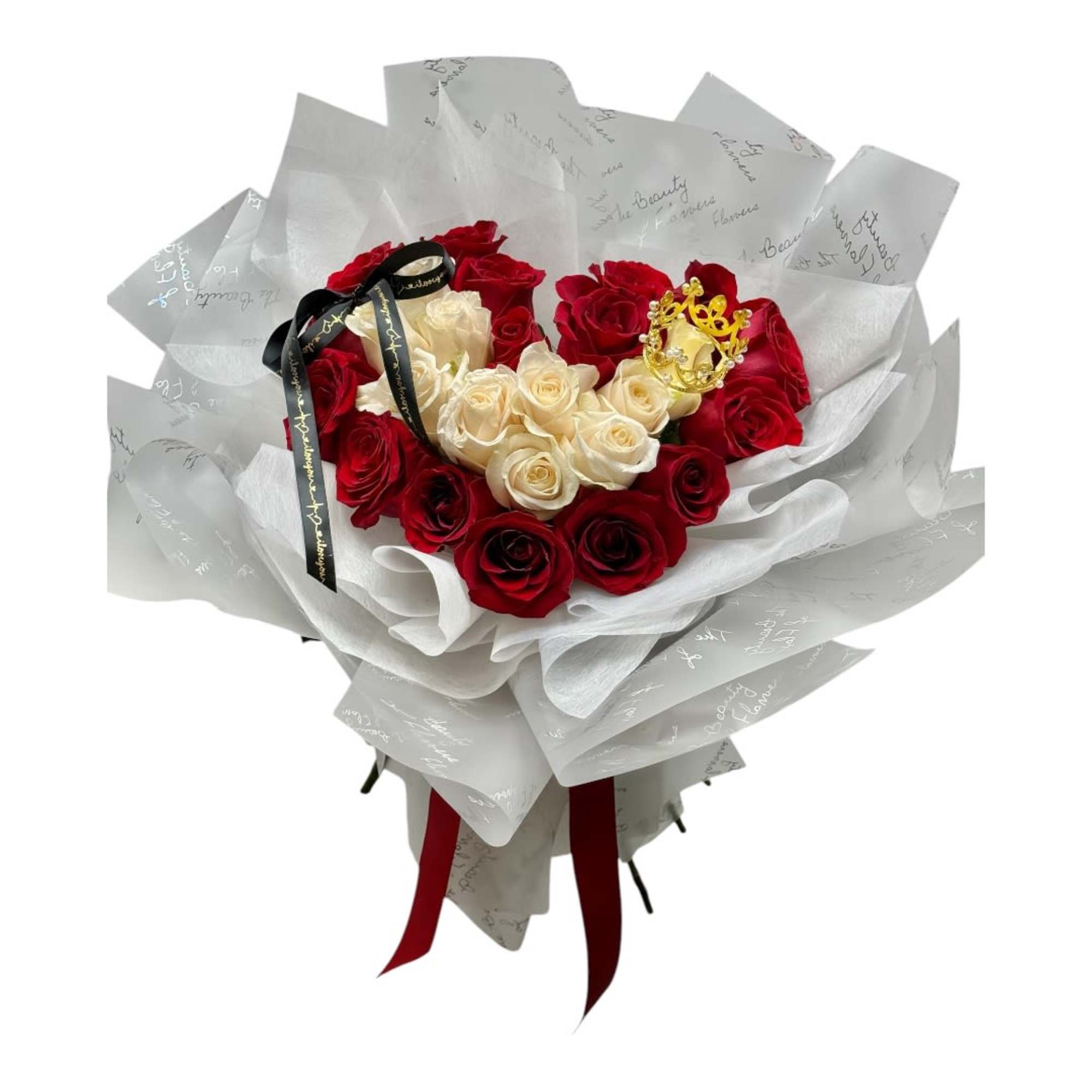 Bouquet of red and cream roses wrapped in white paper with a ribbon