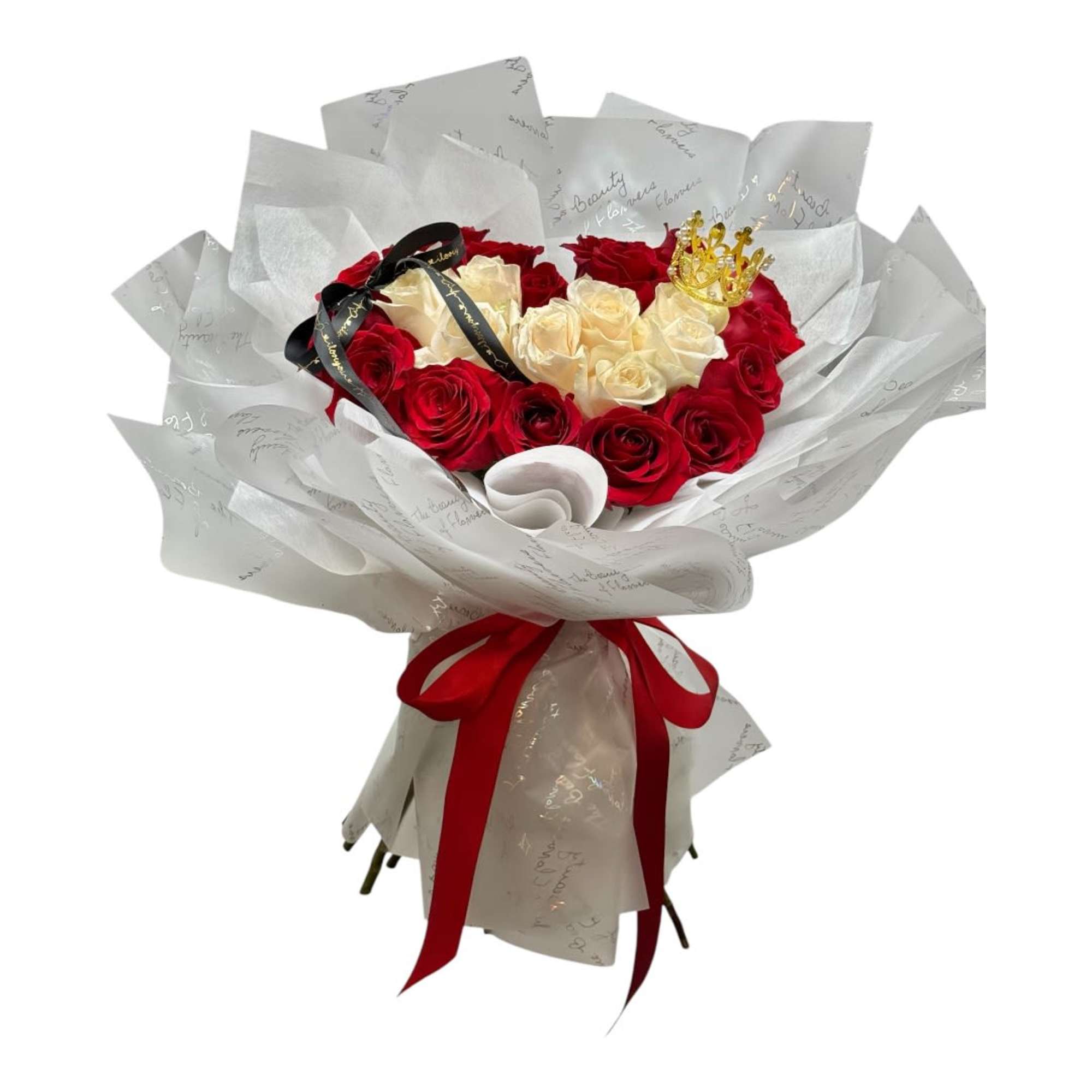 Bouquet of red and cream roses wrapped in white paper with a red ribbon