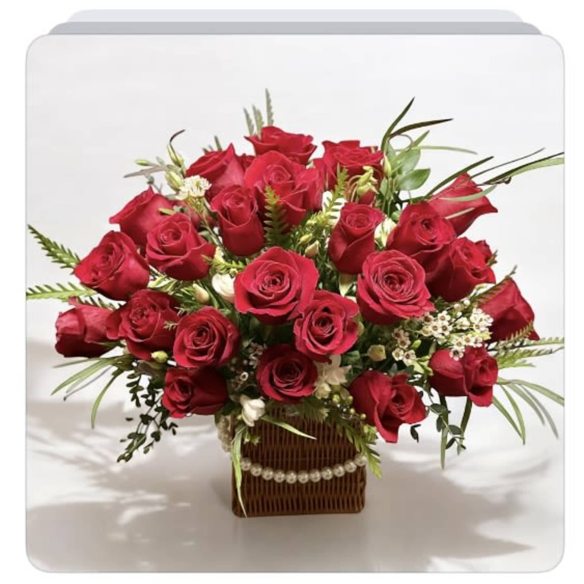 Red rose bouquet in a square basket with pearl trim