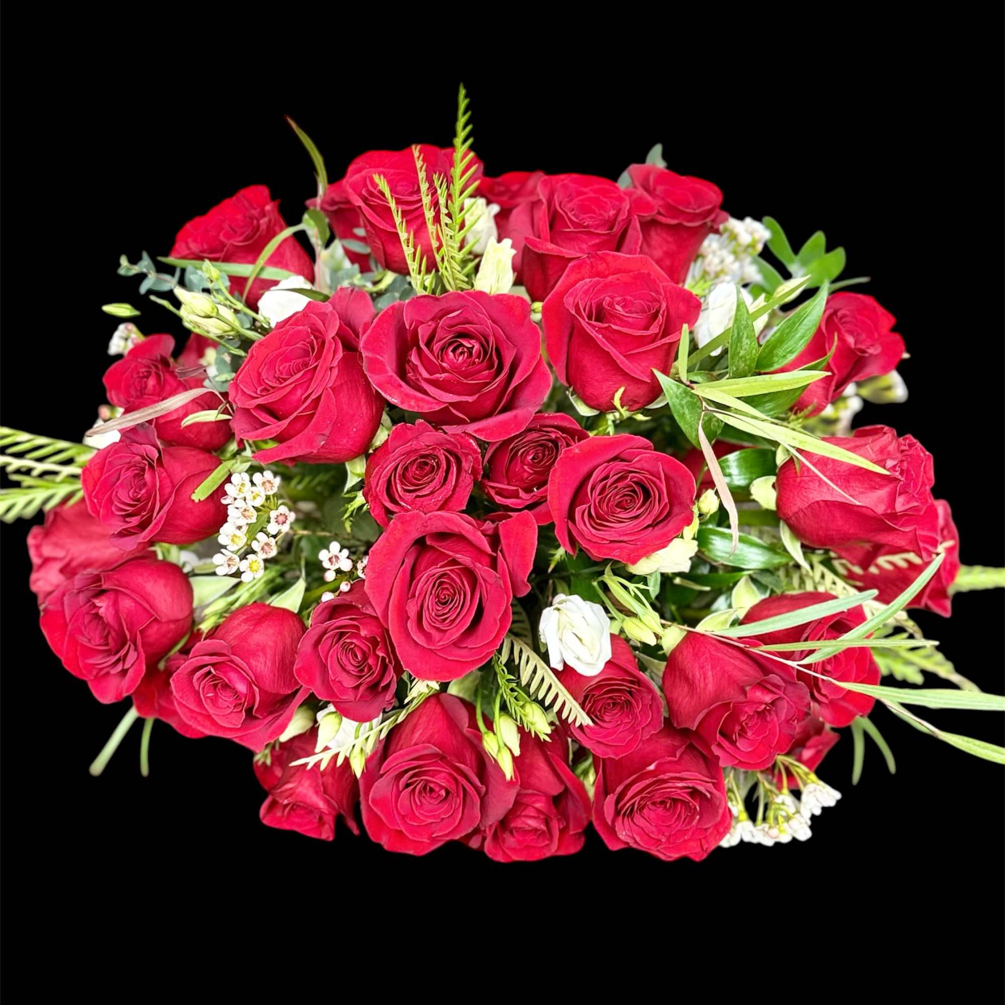 Bouquet of red roses with small white filler flowers