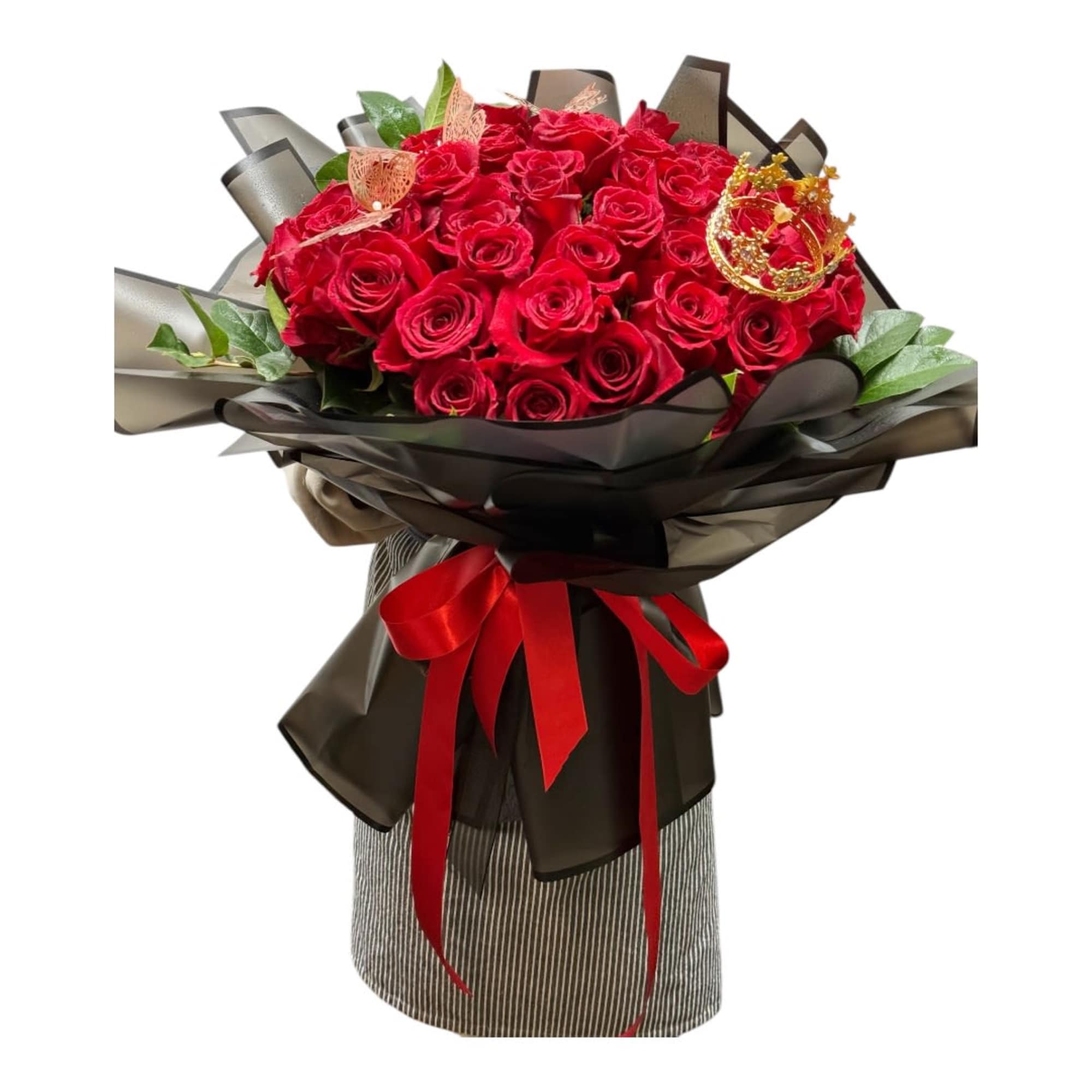 Bouquet of red roses wrapped in black paper with a red ribbon