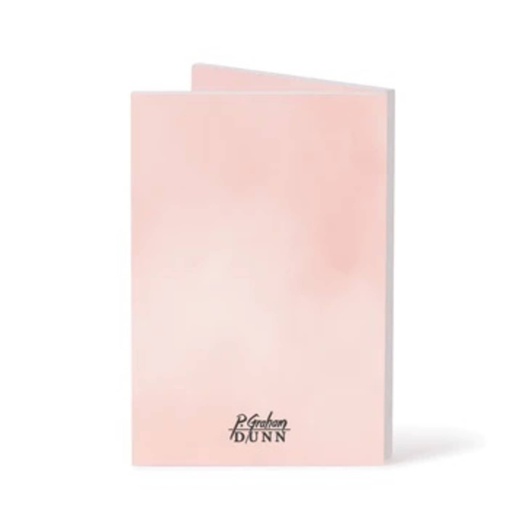 Pink folded greeting card with a small printed logo