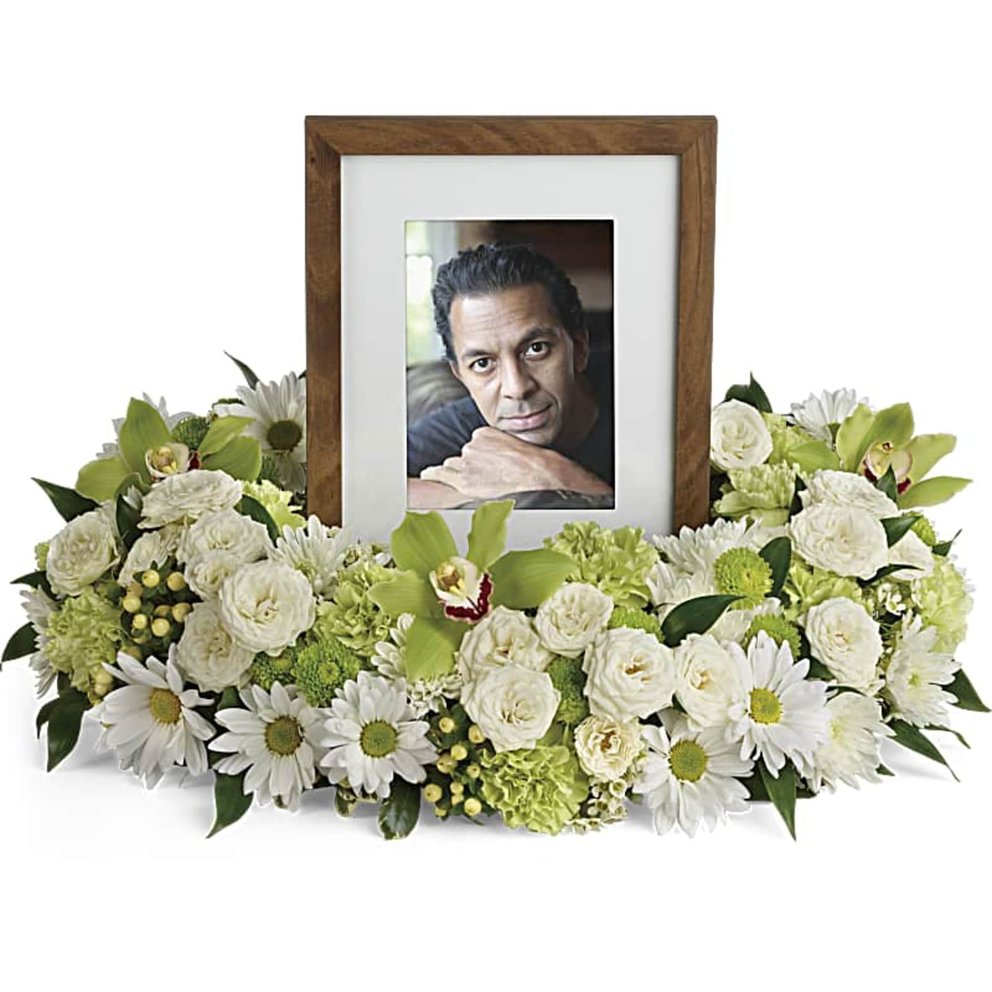 White floral photo frame arrangement with a portrait in the center