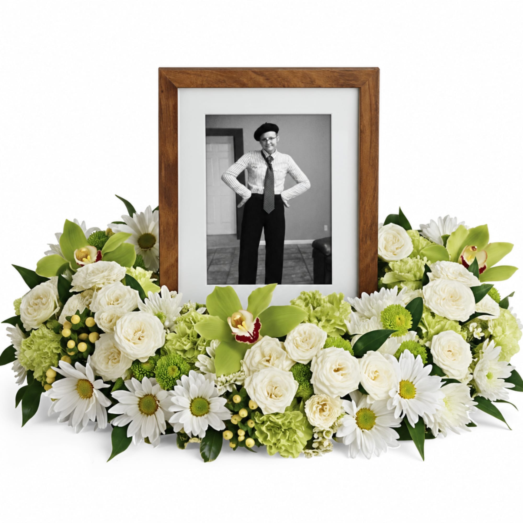 White and green floral frame around a black-and-white portrait in a wooden frame