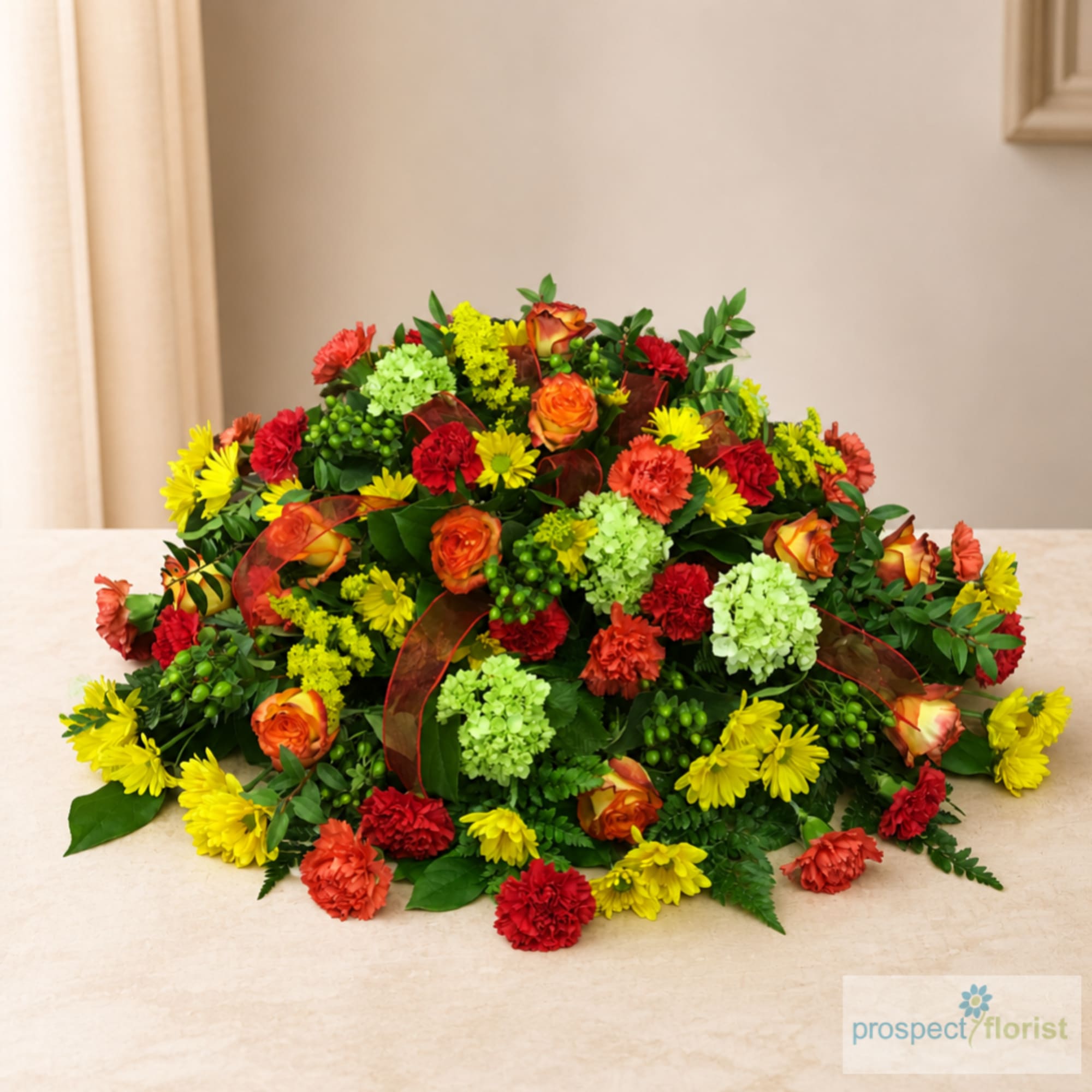 Colorful mixed flower arrangement with roses, carnations, and daisies