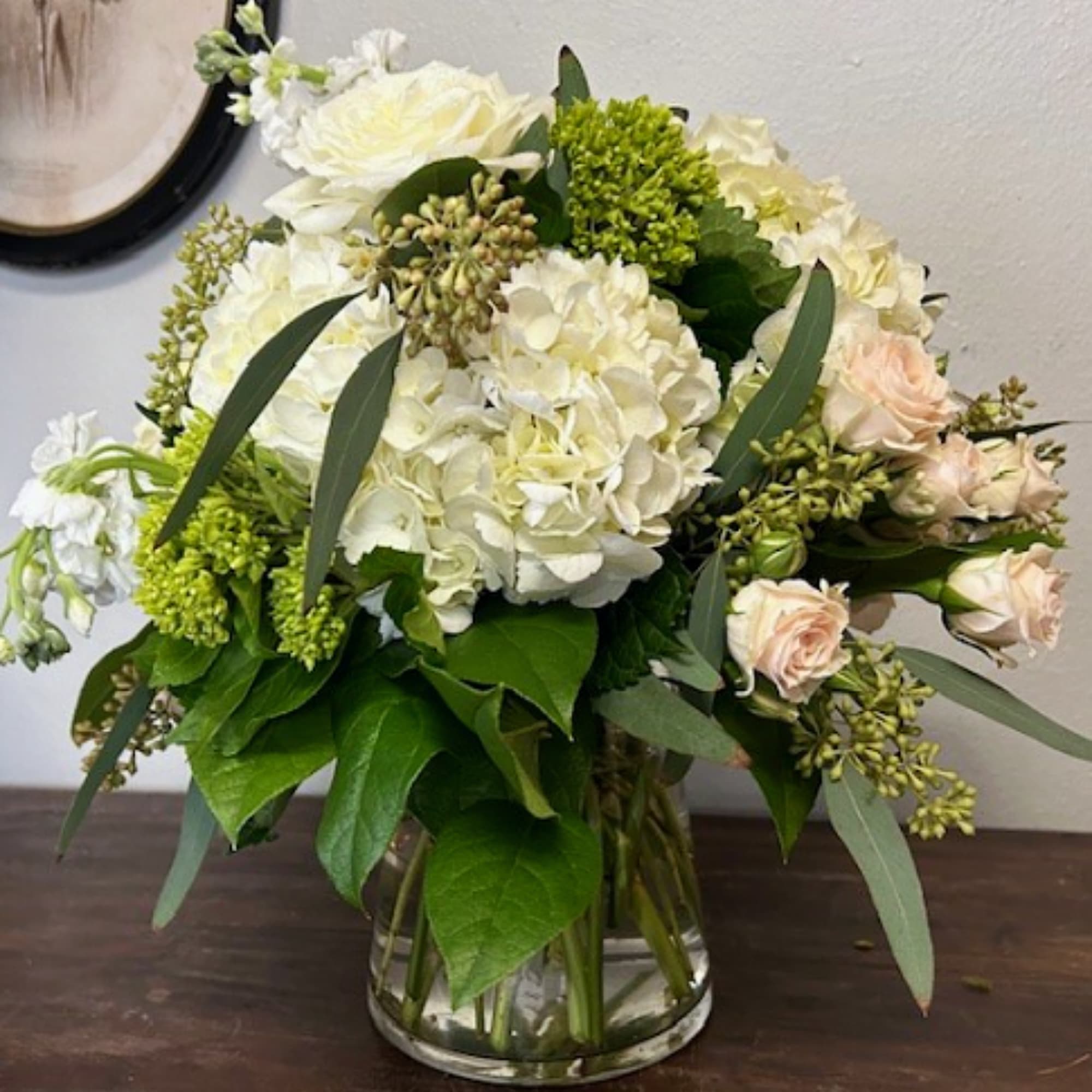 Elegance in Green and White
Introducing "Cool as a Cucumber," an arrangement that