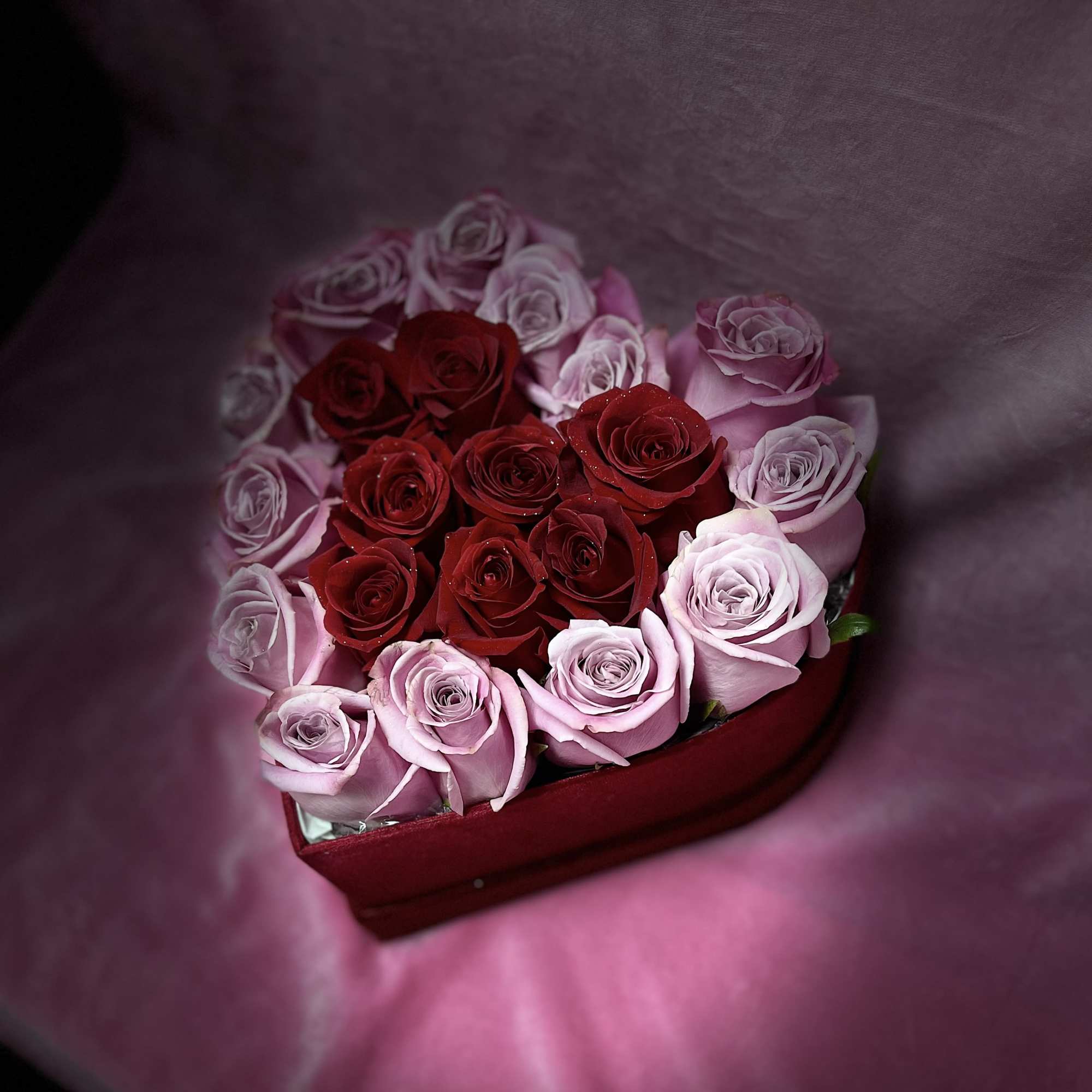 Heart-shaped box of red and pink roses