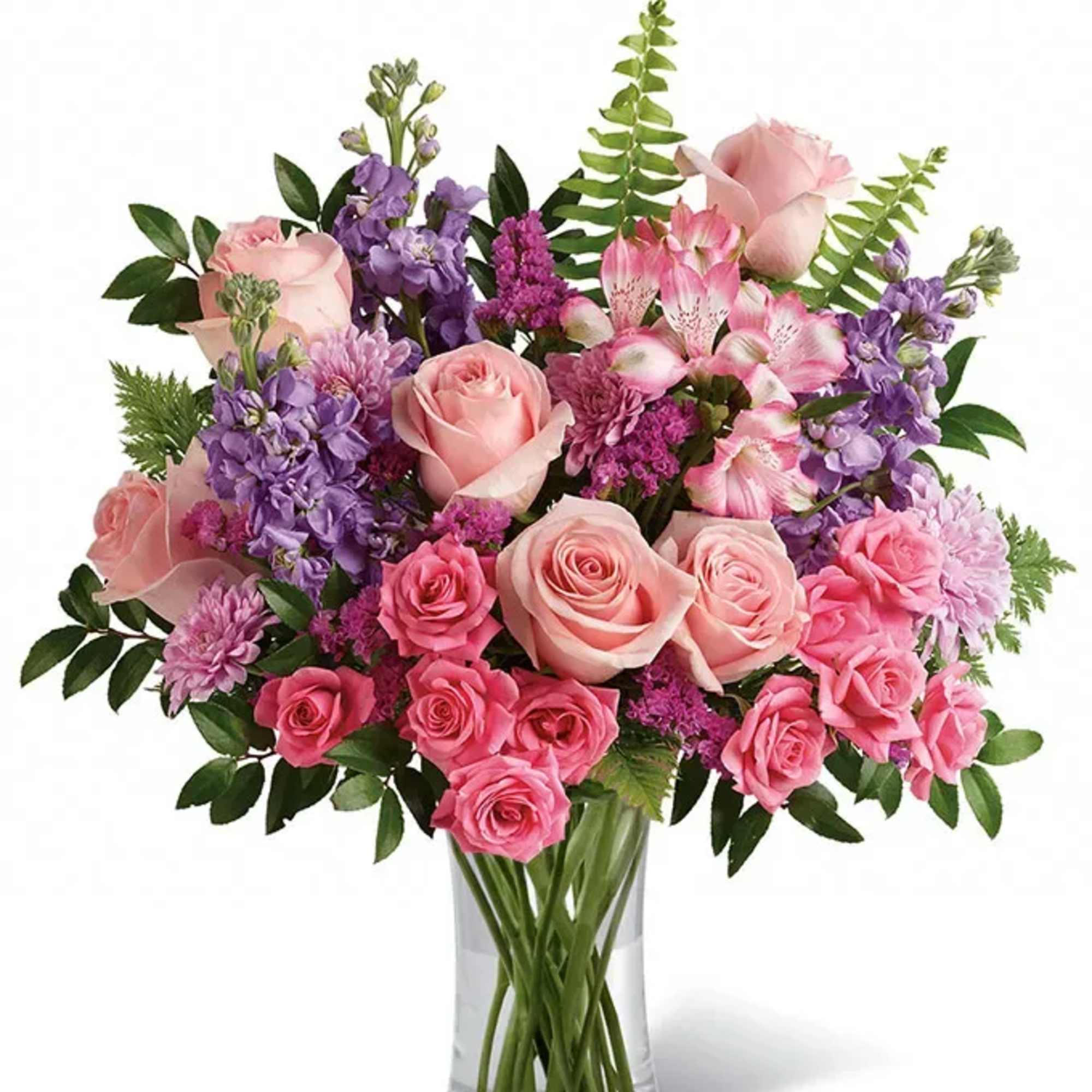 Pink and purple mixed flower bouquet in a clear glass vase