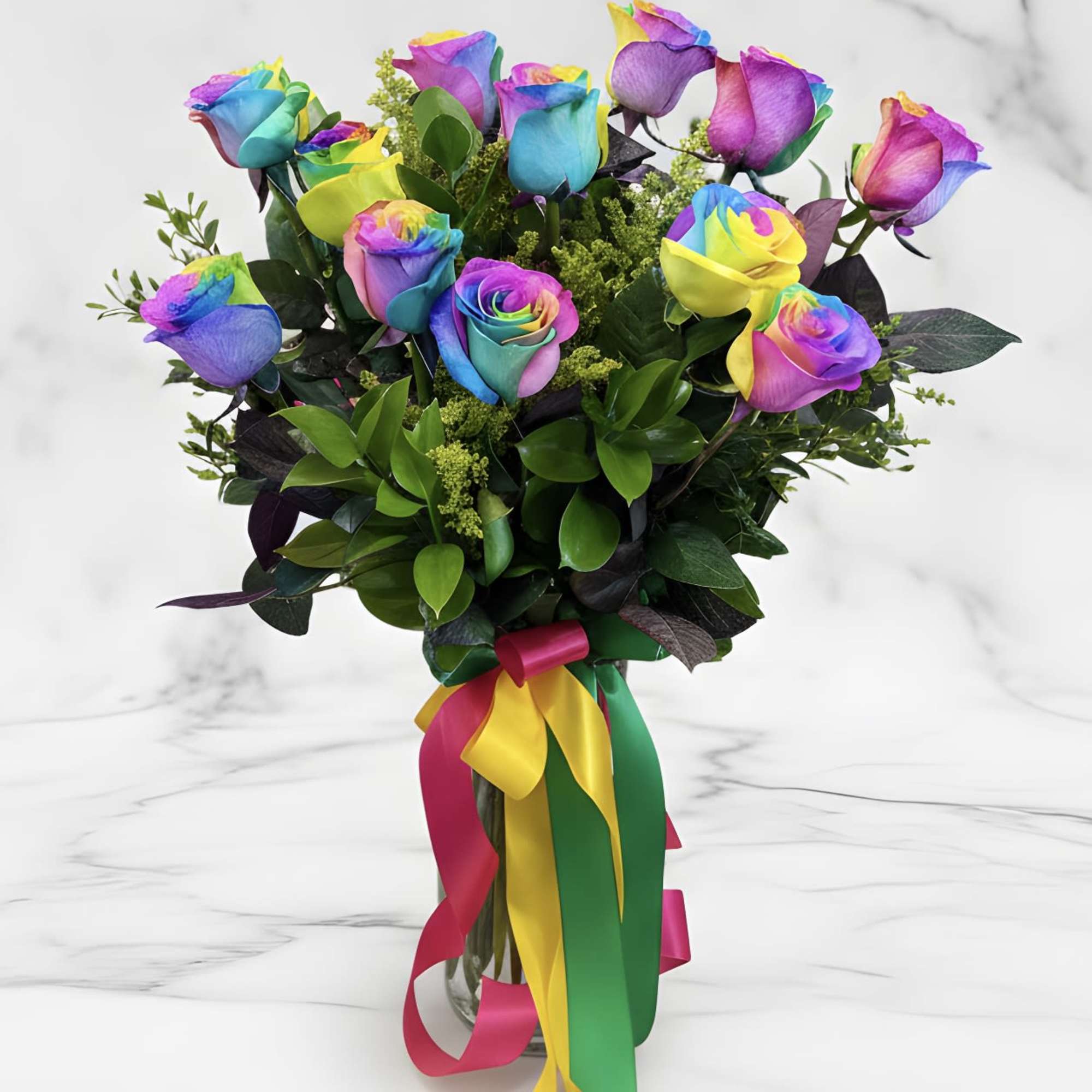 Bouquet of rainbow-colored roses in a glass vase with multicolor ribbons