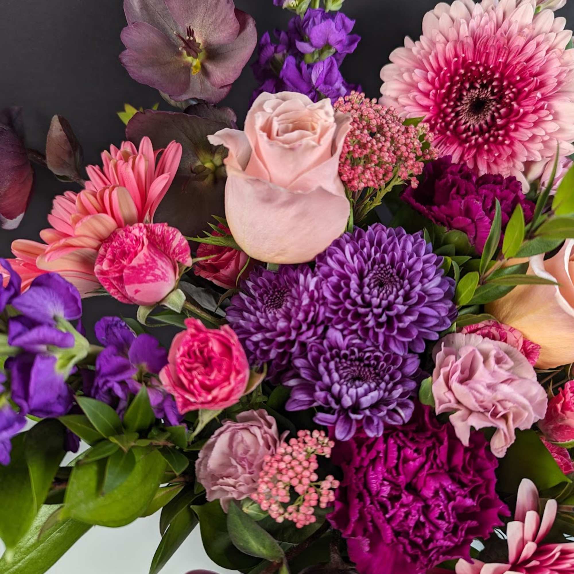 Mixed bouquet of pink, purple, and lavender flowers