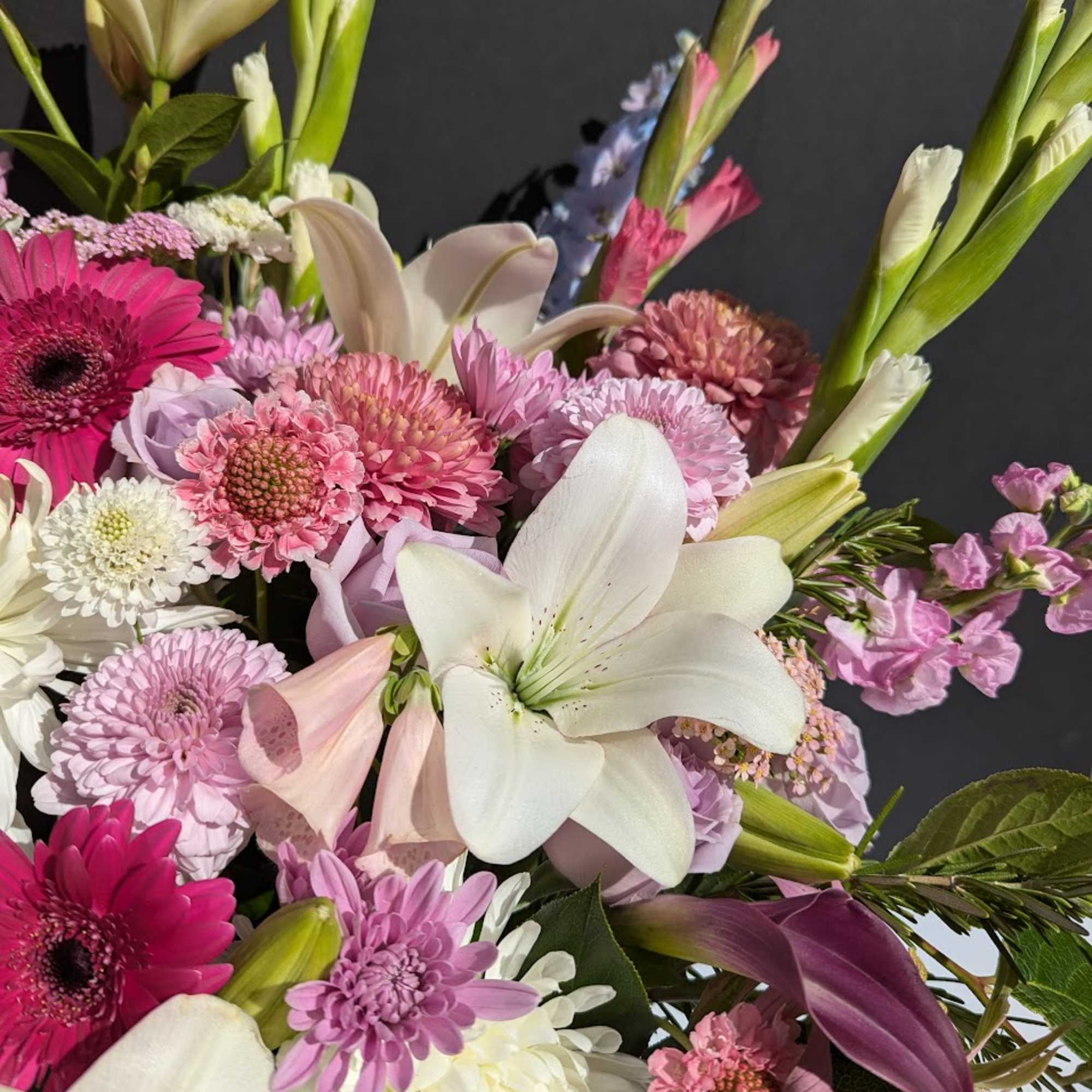 Mixed bouquet with white lilies and pink gerbera daisies