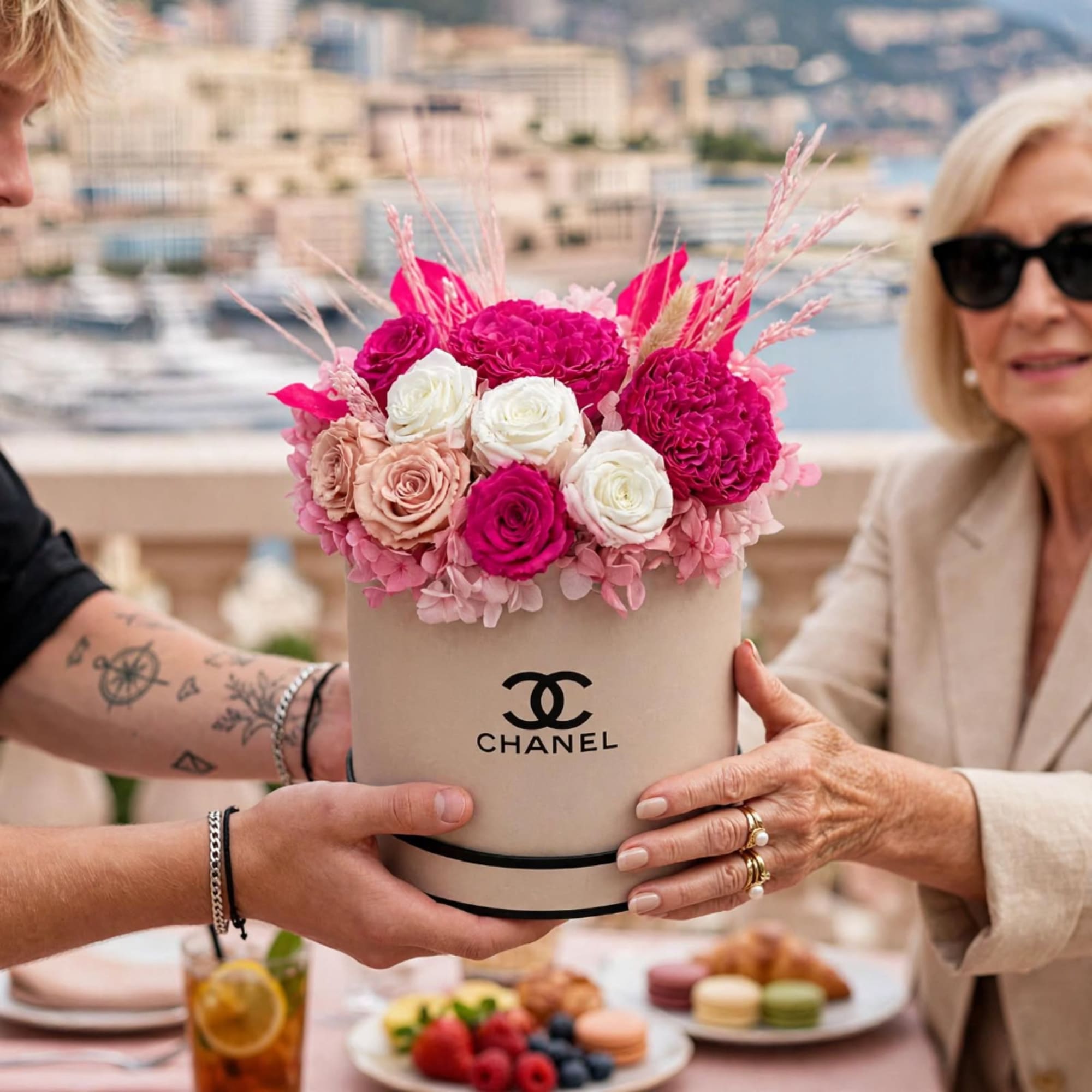 Pink and white roses in a Chanel hatbox