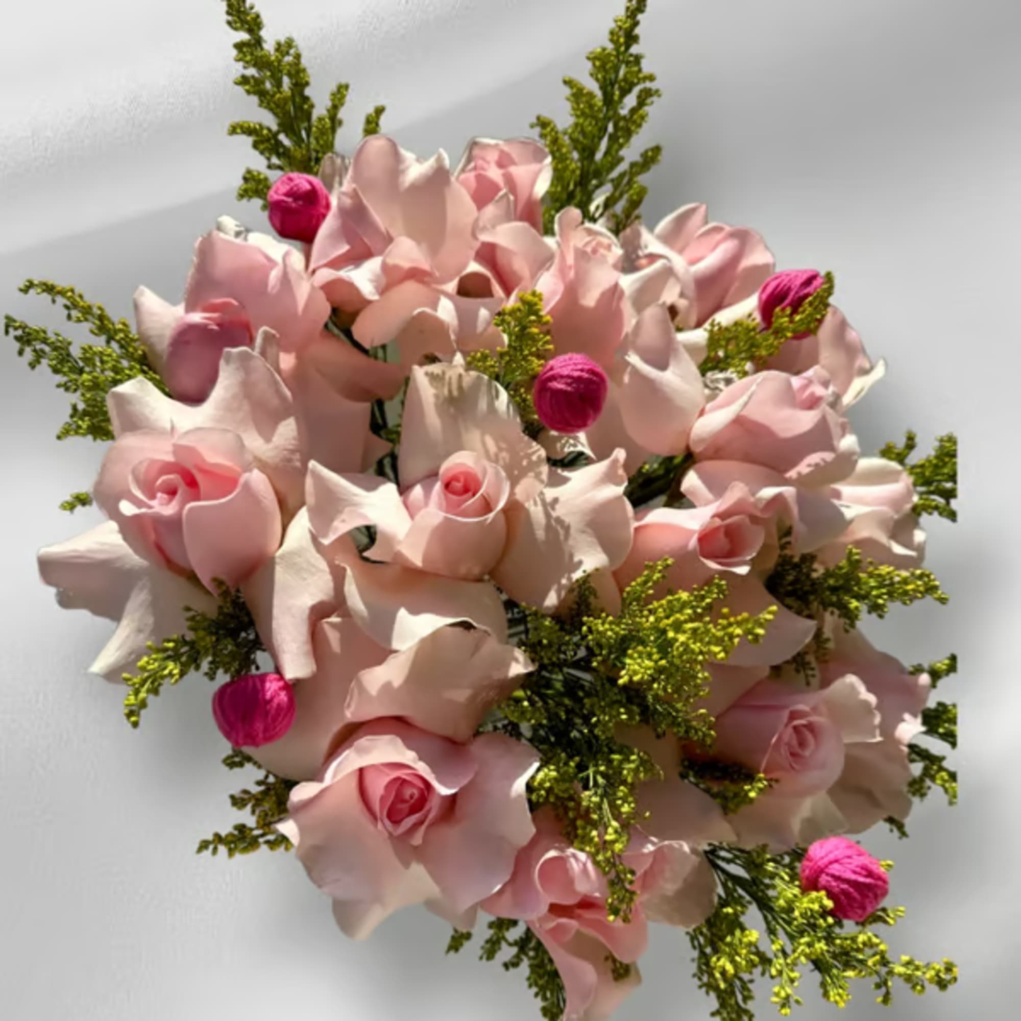 Pink rose bouquet with bright green filler and small magenta accents
